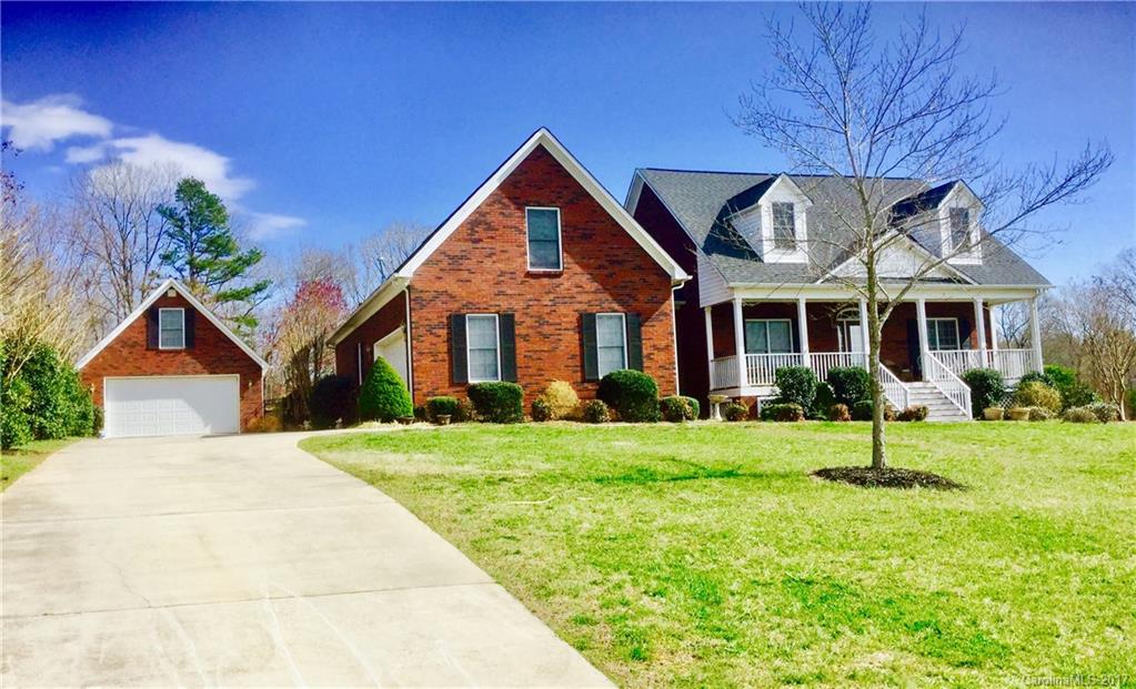 Wonderful, full-brick 4BR/2BA home with open floor plan. One-level living w/hardwoods, cathedral and tray ceilings and screened porch overlooking the refreshing, custom Pebbletec pool. Finished bonus/bedroom over attached garage. 2nd detached garage has over 1000 HSF with workshop down, office up and is metered separately from main house. Located in desired Clover School District with easy access to Charlotte, Gastonia and Rock Hill.