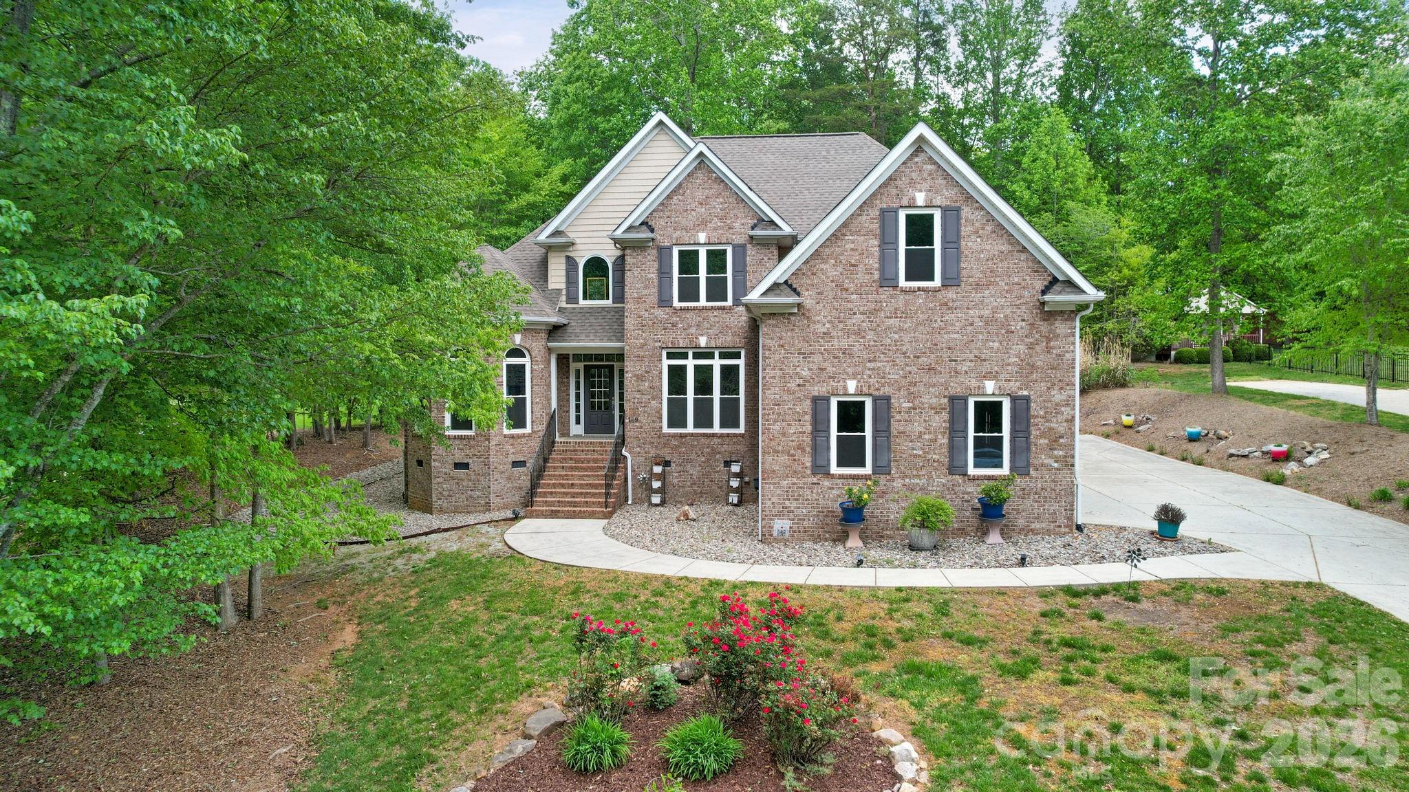 Welcome to 169 Winding Creek Drive in Troutman, NC—an updated home offering quality finishes, a versatile floor plan, and efficient systems throughout. Nestled in a peaceful wooded setting, this property provides both privacy and convenience, just minutes from Lake Norman State Park with extensive recreational amenities and nearby public lake access, including boat ramps.
Recent upgrades include all new custom, energy-efficient windows, a fully updated kitchen, and two beautifully renovated bathrooms. The kitchen features quartz countertops, refinished cabinetry, and all-new stainless steel appliances including a refrigerator, dishwasher, induction cooktop with convection oven and warming drawer, vented microwave, and an oversized sink. Hardwood floors run throughout the main and upper levels, with tile in the bathrooms and laundry areas.
The main-level primary suite offers two walk-in closets, a jetted tub, double vanities, and a walk-in shower. Also on the main level is a dedicated office space with access to a full bathroom—ideal for guests or remote work. Upstairs includes two additional bedrooms, a full bathroom, a bonus room, and generous storage options.
Outdoor living is equally inviting with a composite deck, mature trees offering shade and privacy, and a brand-new pre-wired 10’ x 20’ storage building. For added peace of mind, the home includes a comprehensive $25K Generac Guardian 22 kW whole-home generator system, which provides uninterrupted power throughout the property. Generator is fueled by 2 large propane tanks located on the property.