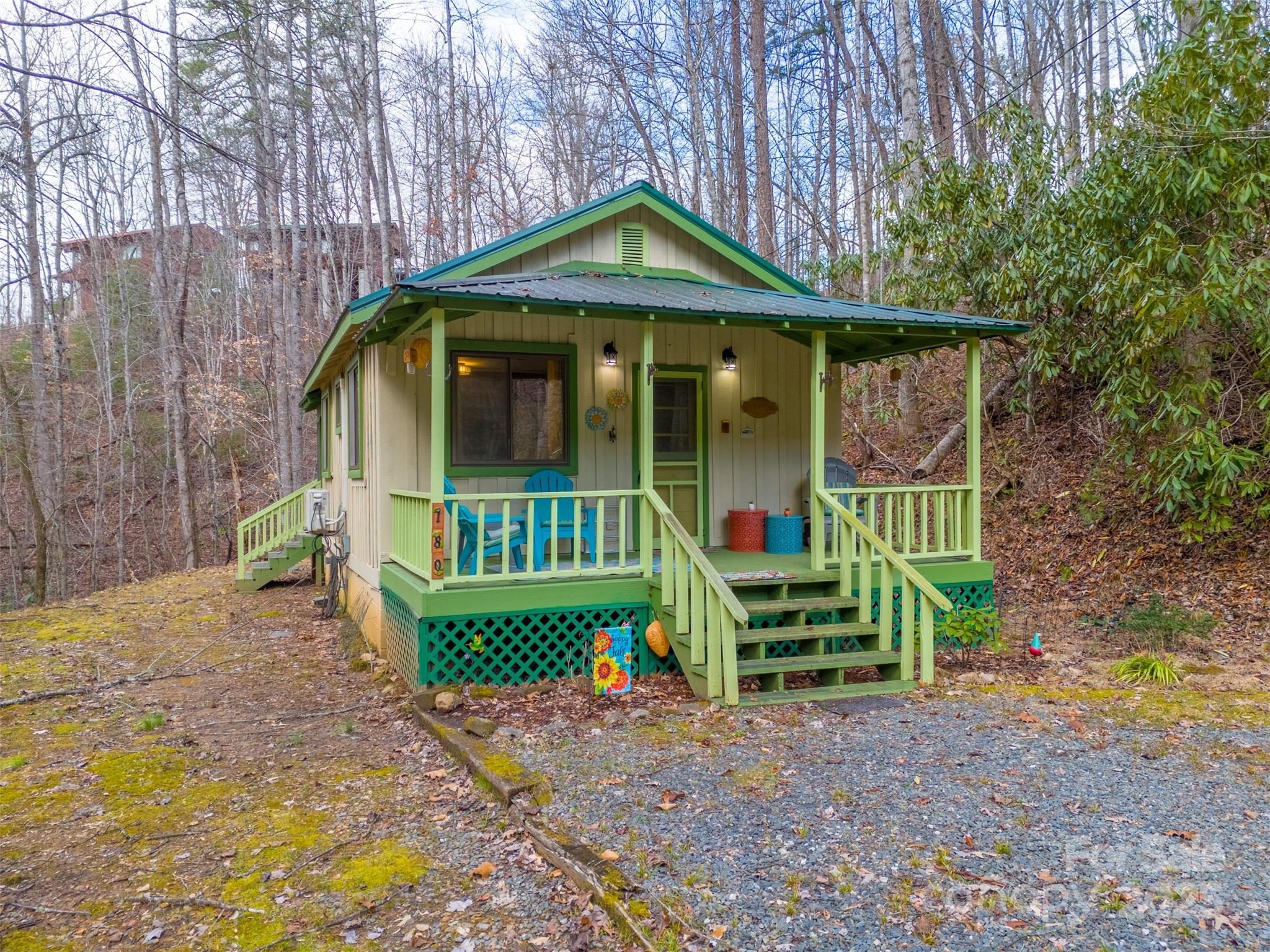 Charming and secluded feeling, yet close to all the attractions in and around Bryson City! This historic 1-bedroom, 1-bath cabin offers a peaceful pond view from the front porch, or you can relax on the screened back porch, surrounded by the beauty of nature. For adventure lovers, the cabin is less than four miles from the Nantahala Outdoor Center, offering whitewater rafting, kayaking, hiking trails, dining, and shopping. Fontana Lake is within hiking distance! Plus, you're just 10 miles from the Great Smoky Mountain Railroad and about 25 minutes from Harrah's Cherokee Casino. This turn-key cabin includes beautiful linens for easy turnovers, a DVD player, and a large collection of DVDs, making it an excellent short-term rental or a cozy weekend retreat. It's being sold fully furnished—ready to enjoy or rent out immediately!