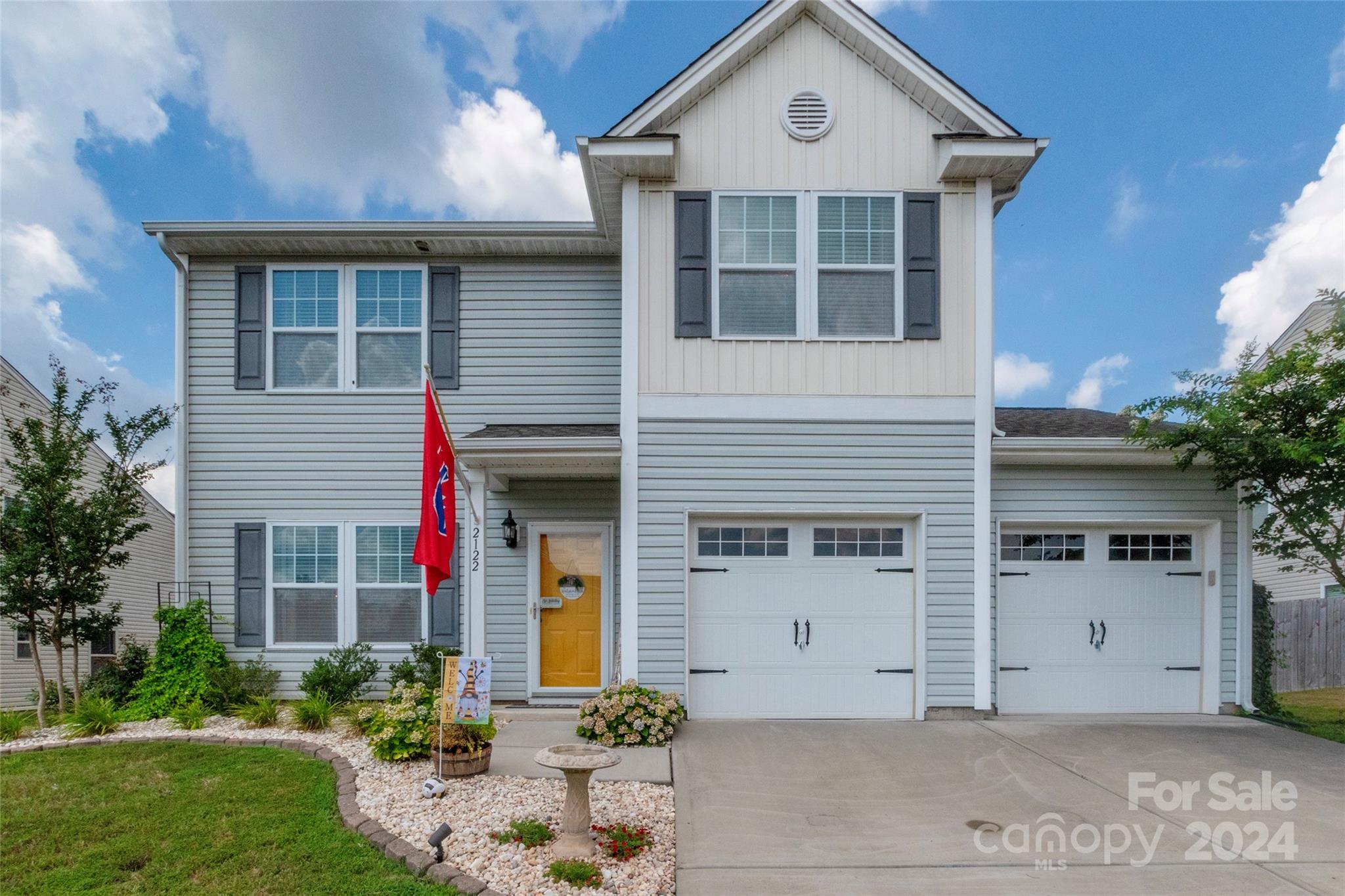 Nestled in a desirable Clover location, this exquisite 3 bedroom, 2.5 bathroom home exemplifies both elegance and comfort. From its captivating curb appeal highlighted by beautiful hydrangeas gracing the front yard to the inviting great room that includes a fireplace with stone surround, every detail of this residence exudes warmth and style. This home features a versatile flex room on the main level, with all bedrooms conveniently located on the upper level alongside a spacious loft area. Step outside to discover a private oasis, complete with a patio adorned with a stone fireplace overlooking an in-ground pool—an ideal setting for both relaxation and entertaining. The covered back patio, features 3 convenient pull-down shades and string lights that convey. Additionally, a shed bolted to a concrete pad and sealed, ensures ample storage space for tools and equipment. UV light has been added to the HVAC. Embrace the opportunity to make this exceptional property your own!
