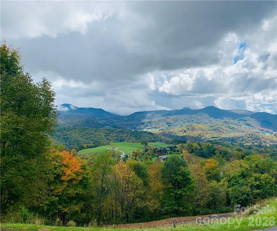 Gorgeous views abound from these two acres in Fox Pointe Too! Two lots make up this property that looks back at Grandfather Mountain and Sugar Mountain. Wooded for privacy yet minimal clearing for a build will open up magnificent year-round views. Beech Mountain views with Avery County taxes, underground utilities, cable, shared well and only the septic is needed! In this small, gated community with restrictions you feel off the beaten path yet convenient to Banner Elk and Beech Mountain and all they have to offer such as shopping, dining, skiing, golf, tennis, skating, tubing and hiking, you name it. Partial grading for driveway has been done. Call for a showing of your new homesite!