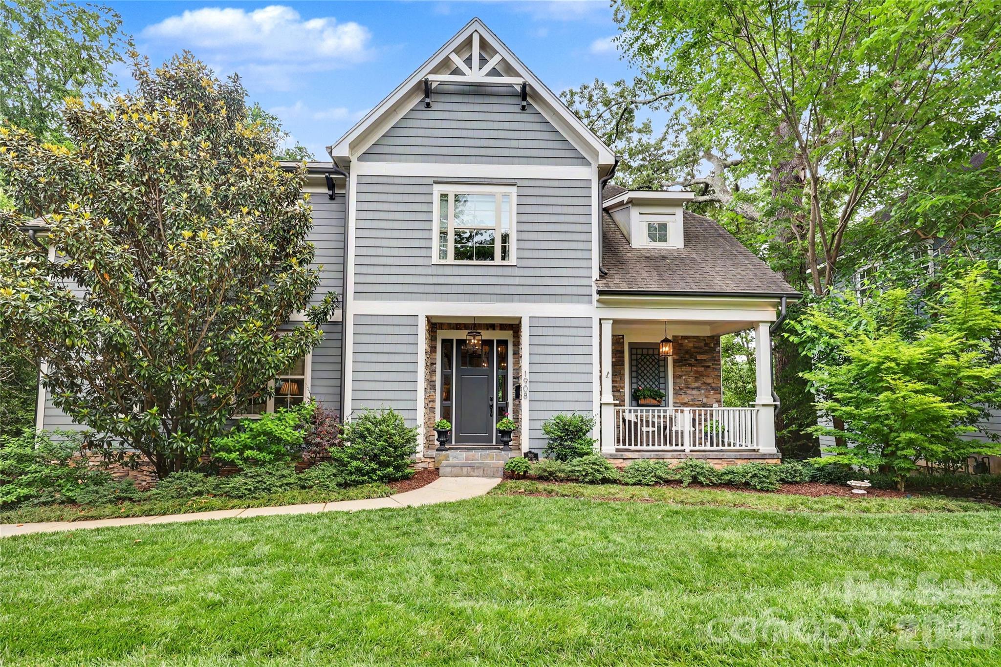 Custom-built Midwood home with an exceptional 3-story floorplan and fully finished basement, ideally situated on sought-after Nassau Boulevard. Thoughtfully designed for both everyday living and entertaining, this home welcomes you with a stunning foyer that opens to a light-filled dining room featuring coffered ceiling. 10 ft ceilings, beautiful moldings and gorgeous hardwood floors.
The spacious kitchen (KitchenAid range 2026, fridge 2025 and dishwasher 2024) with breakfast area flows seamlessly into the large living room with a beautiful limestone fireplace, creating the perfect gathering space. A guest bedroom on the main level, along with both front porch and rear deck access, offers flexibility and easy indoor-outdoor living.
Upstairs, a cozy sitting area leads to the expansive primary suite with vaulted ceilings, dual vanities, soaking tub, walk-in shower, and a large custom closet with built-ins. Two additional bedrooms share a Jack-and-Jill bath, and the upstairs laundry room adds convenience.
The finished basement offers endless possibilities with a bar area, bonus room, additional bedroom and full bath — all filled with natural light and opening seamlessly to the beautifully landscaped, turfed backyard, with bluestone patio and two-car garage.
Tucked away in one of Midwood’s most desirable locations, this home offers a rare sense of privacy while remaining just moments from all the dining, shopping, and charm of Plaza Midwood. A truly special opportunity not to be missed.
