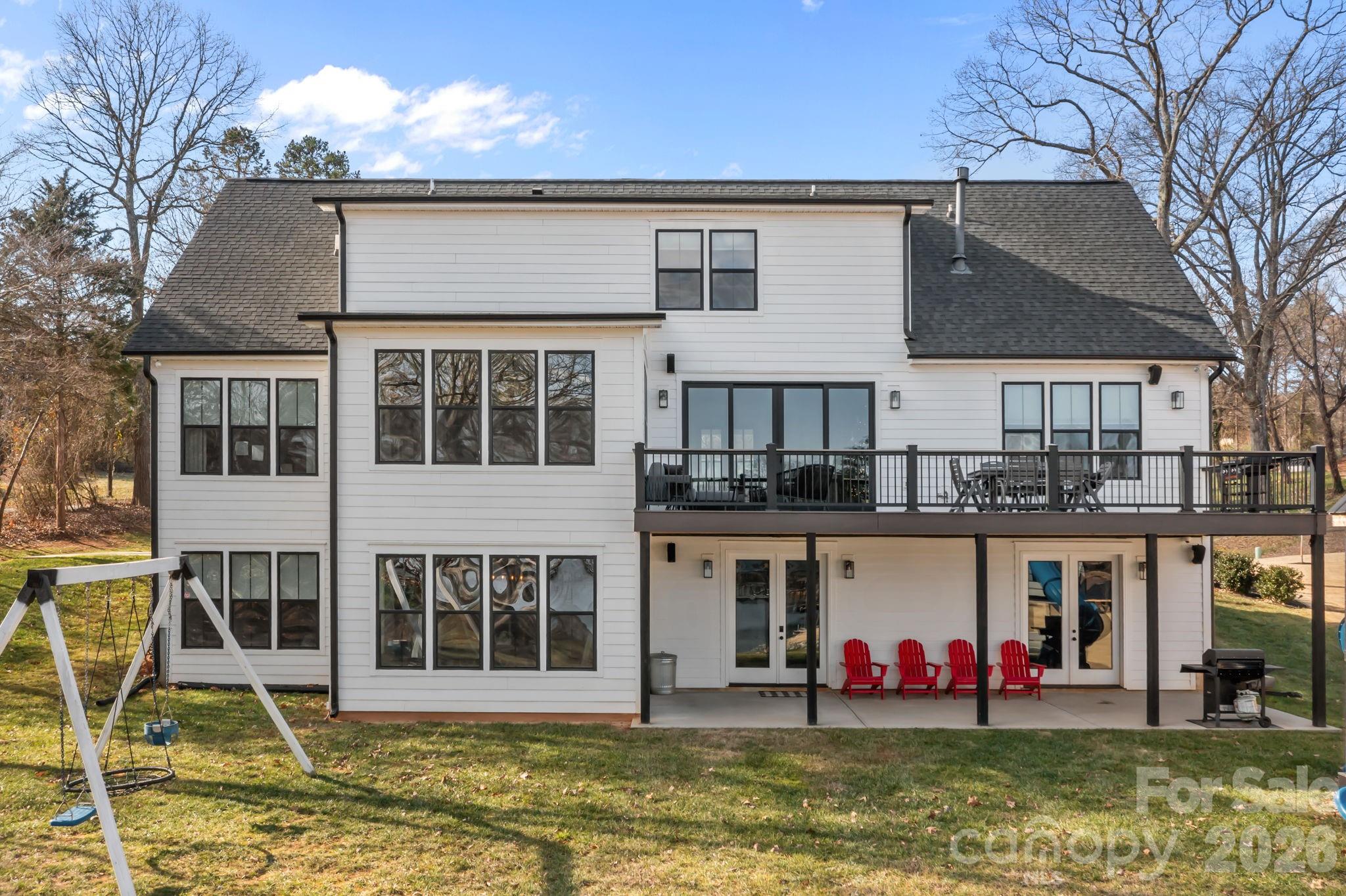 Discover the perfect blend of livable luxury at this exceptional Lake Norman waterfront residence, complete with the convenience of a grandfathered private *boat ramp*.  This unique waterfront cove is distinguished by a natural spring flowing through it, enhancing the shoreline with a peaceful, organic element that brings beauty, character, and purification.  Perfectly positioned to capture unobstructed lake views, this classic, custom home blends timeless design with a modern twist in one of the area's most sought-after settings.

Situated at the end of an extended driveway for added privacy, you are met with striking curb appeal and a tranquil atmosphere. Enjoy just under 3 *acres* of one of the few coveted large lots on Lake Norman.  Inside, expansive windows fill the space with natural light while framing picturesque year-round *water views* throughout the main living areas. The functional floor plan provides effortless livability. It's ideal for both everyday living and upscale entertaining, featuring refined finishes, custom craftsmanship, and seamless indoor-outdoor flow.

At the heart of the home, the gourmet kitchen offers premium appliances, generous cabinetry, and a spacious island—perfect for gathering with family and friends after a day on the lake. The primary suite serves as a retreat with calming water views and a spa-inspired En suite.  The additional bedrooms and living spaces provide limitless flexibility, comfort, and privacy for guests.

Outdoor living is where this property truly shines. Enjoy peaceful mornings by the water in this quiet cove, sunset evenings, and the convenience of your private boat ramp and dock.  Spontaneous activities like boating, paddleboarding, jet skiing, and fishing can be part of your everyday life. You have plenty of space to create your own backyard oasis, whether it's your dream *pool*, pickleball court, putting green, or outdoor cabana...the options are endless!! Hosting lakeside gatherings or enjoying simple moments on the shore, this property delivers an elevated waterfront experience.  

Ideally located near shopping, dining, healthcare, and everyday comforts—yet offering the sought-after benefits of lakefront living—you will find your own sweet slice of waterfront paradise here! (Some photos are virtually enhanced)
Motivated sellers!!
