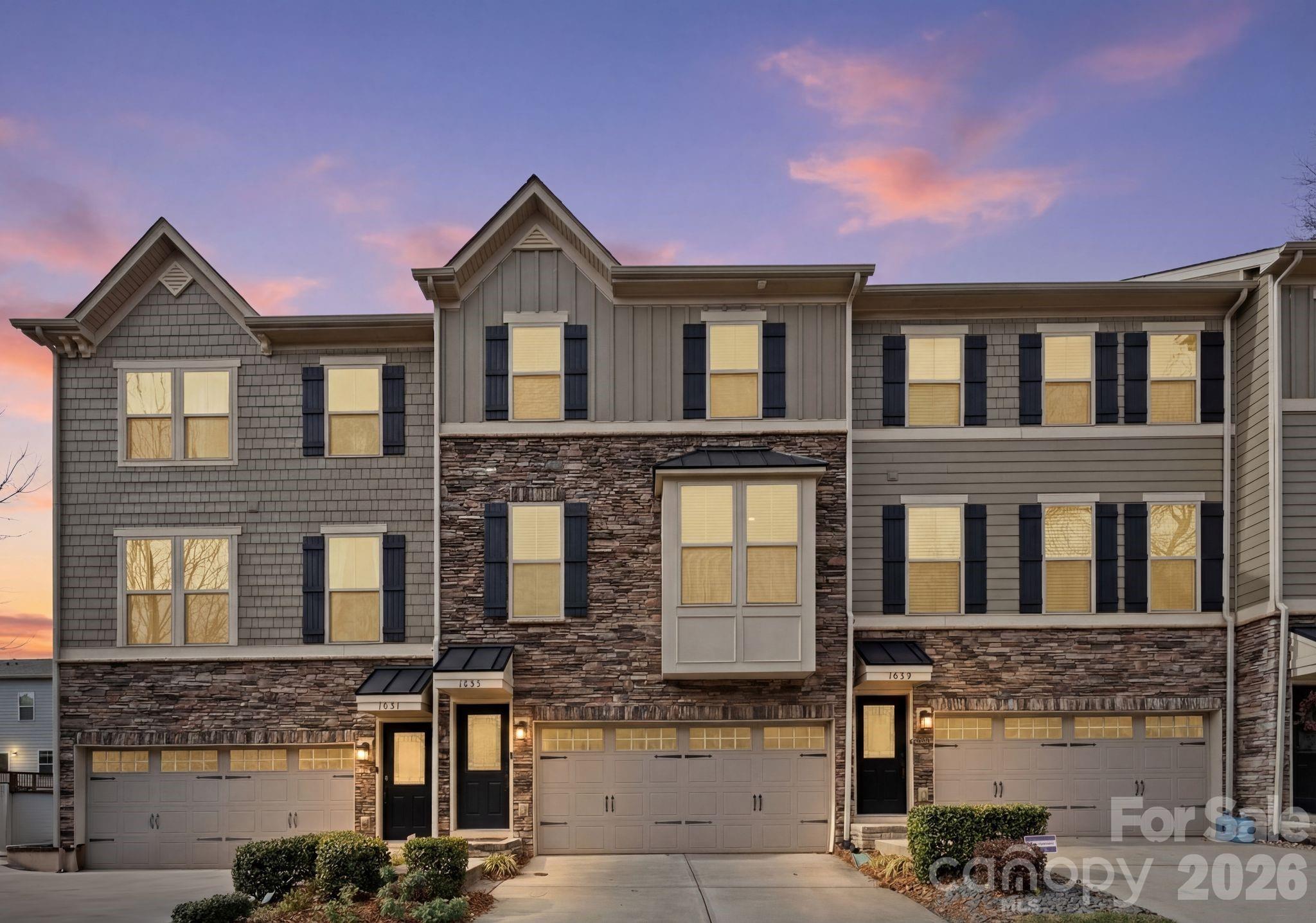 Welcome to 1835 Shumard, a beautifully updated 3-bedroom, 2.5-bath home offering 2,400+ square feet of space, style, located in Oakhurst- One of Charlotte's fasting growing neighborhoods. This Move-in ready home features soaring ceilings and abundant natural light throughout the open-concept living, dining, and kitchen areas—perfect for everyday living and entertaining. The living room is pre-wired to conceal HDMI cables and includes a 5.1 surround sound system for a seamless home theater experience. Sliding doors lead to a private deck, ideal for relaxing or hosting guests. A stylish office space off the kitchen showcases designer wallpaper, adding character and charm. Upstairs, all four bedrooms are conveniently located near the full laundry room. The spacious primary suite features a large walk-in closet, while a secondary bedroom includes a custom geometric accent wall for added personality. The lower level offers a versatile bonus space—perfect for an office, gym, or additional living area—and connects to the 2-car garage, which includes a dedicated 20-amp circuit in the garage. With easy access to Uptown, Plaza Midwood, Cotswold, and SouthPark, this location truly delivers convenience and lifestyle. Welcome home.