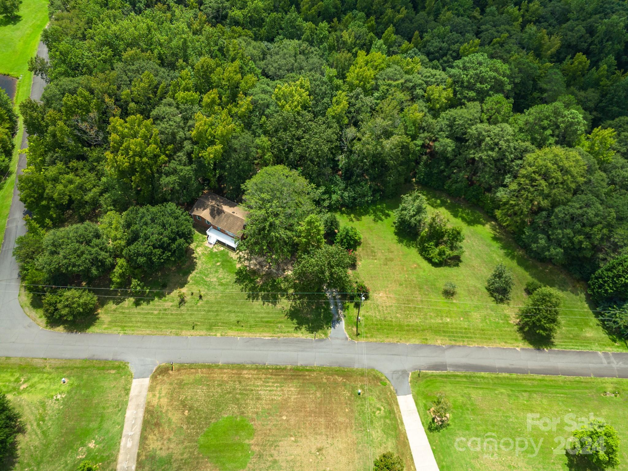 All Brick Ranch with walk out Basement, Garage ,and 3.87 acres! Possible 3rd bedroom in basement or office. Basement can be used as separate living quarters with bedroom , full bath , and private entrance.  Endless possibilities with plenty of space to build or expand. Brand new front porch, Hardwood floors throughout main level, Kitchen has new custom cabinets with granite countertops, full tile showers, fireplace on each level, fresh paint, All appliance to remain, must see!  Septic records not found on file.