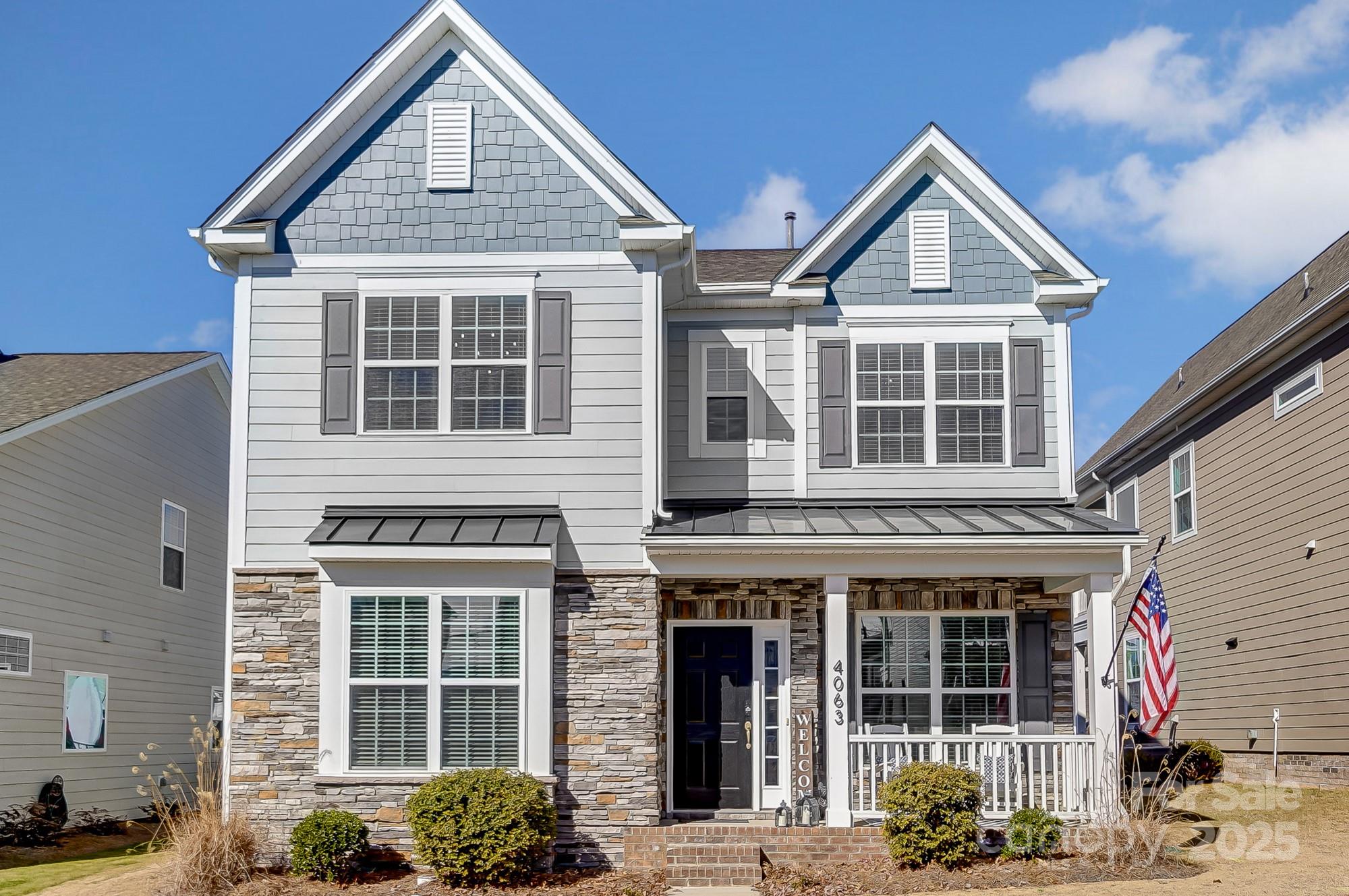 Welcome to this stunning Charleston-style home in Tega Cay’s Cameron Creek neighborhood! This 3-bedroom, 2.5-bath residence blends timeless charm with modern functionality for stylish living. The open-concept floor plan features a kitchen with granite countertops, a gas range, a breakfast bar, and a pantry, flowing seamlessly into the sunlit family and dining areas. A dedicated main-level office and rear-entry 2-car garage add convenience.

Upstairs, the primary suite offers a walk-in closet, wall molding, and a spa-like bathroom with a garden tub, shower, and dual sinks. Two additional bedrooms, a secondary bath with dual sinks, and a laundry room complete the second floor.

The fenced backyard is perfect for outdoor activities, and recent updates include new vinyl plank flooring upstairs and fresh interior paint. Enjoy community amenities like a pool, playground, and recreation area, all close to Lake Wylie, shopping, dining, and I-77. Don’t miss this gem!