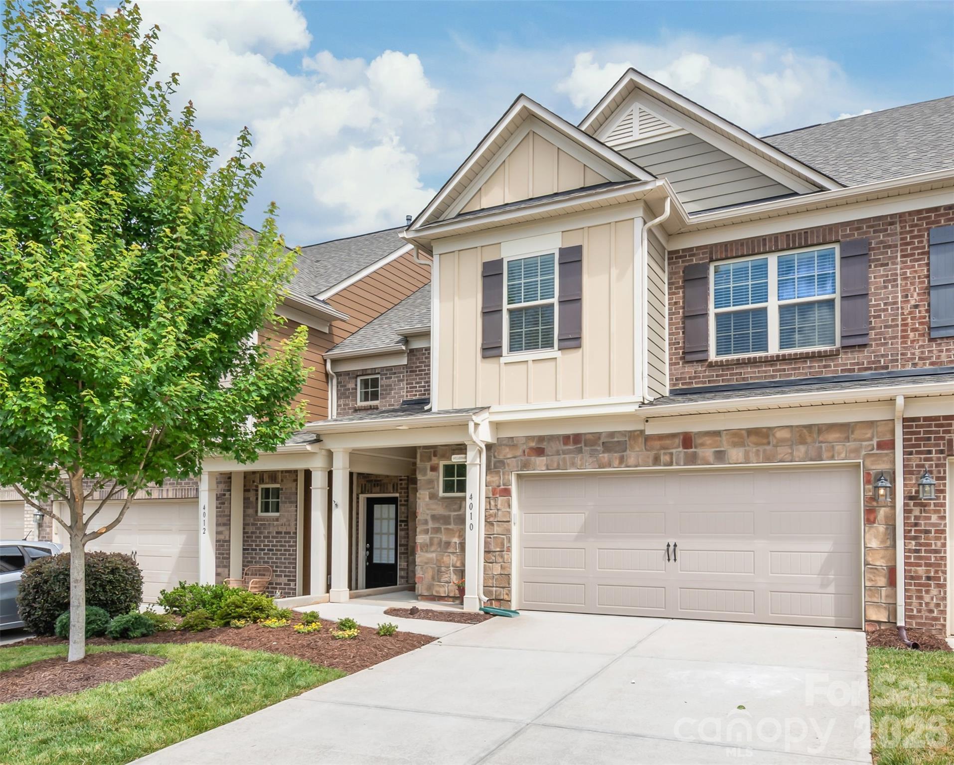 $5,000 Buyer Incentive! To help you secure your dream home, the seller is offering a generous credit to use toward closing costs or a rate buydown. Welcome to this pristine, move-in ready home in the highly desirable Bridgemill neighborhood of Indian Land, SC. There is literally nothing left to do here but unload, unpack and enjoy!  The entire home has been freshly painted from top to bottom and features brand-new carpet upstairs. You will love the seamless flow of the fabulous, open-concept floor plan where the Den, Dining Area, and Kitchen blend together perfectly making it ideal for everyday living or entertaining family and friends. Upstairs, the massive Primary Suite is a true retreat, boasting an elegant tray ceiling, crown molding, a giant walk-in closet. The spa-like bath features a large tile-and-glass walk-in shower plus 2 linen closets. Two additional spacious Secondary Bedrooms and a dedicated, true Laundry Room round out the second floor.  This property is rather unique in that it features a patio with green space and privacy fencing on the side.  Your view out the back is common area and not another building.  It’s a great space for relaxing, outdoor play or hosting a barbecue.   Best of all, you are just steps away from a green space for dog walking or play.  Down the street is Bridgemill’s incredible resort-style amenity center including the community clubhouse, pools, tennis courts, and playground. Just outside the Bridgemill neighborhood you will find anything from a daycare to a butcher shop to Costco plus the new MUSC Indian Land Medical Center which opens next year.  What could be better?  Don't miss this incredible Indian Land opportunity—schedule your tour today and make this beautiful house your home!
