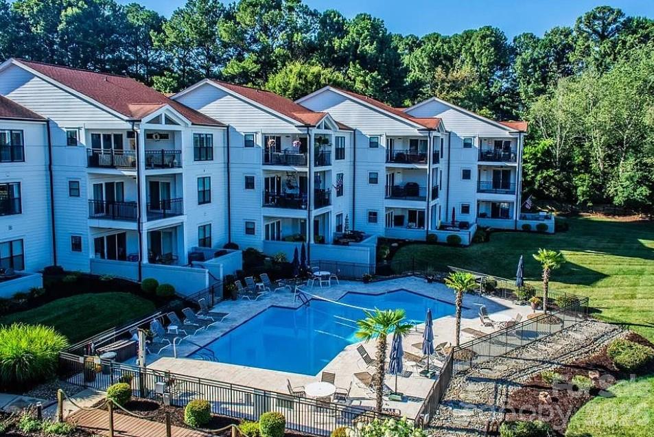 Perched on the third floor in the highly desirable Half Moon Bay community, this inviting condo offers beautiful views of Lake Norman and a relaxed, low-maintenance lifestyle in the heart of Cornelius. Enjoy peaceful mornings and stunning sunsets from your private vantage point overlooking the water.

Inside, the open-concept layout is filled with natural light, creating a bright and airy feel throughout the main living space. The living room flows seamlessly into the dining area and kitchen, making it ideal for both everyday living and entertaining. Large windows and sliding glass doors showcase the lake views and bring the outdoors in.

The spacious primary suite provides a comfortable retreat, while an additional bedroom offers flexibility for guests, a home office, or hobbies. Thoughtful design and easy flow make the home both functional and welcoming.

Seller is offering 'Buyer Choice' credit at closing with acceptable offer that the buyer may use toward, home improvements such as paint allowance

Located just minutes from shopping, dining, and marina access, this condo combines convenience with scenic charm. Whether you're looking for a full-time residence, weekend getaway, or investment opportunity, this Lake Norman-view property delivers the best of lakeside living.