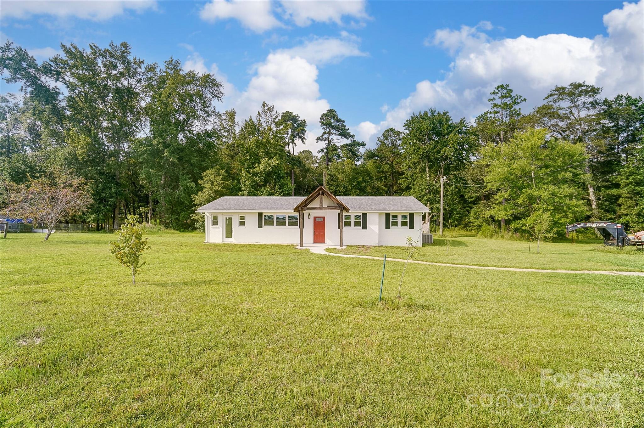 Nestled on nearly 2 acres of serene countryside, this beautifully renovated ranch home offers the perfect blend of modern comfort and rustic charm just minutes from local amenities here in Lancaster. This renovated home welcomes you with a new covered front porch with gorgeous beams. Step through the front door to an open-concept floor plan with new flooring, paint, updated kitchen and bathroom. The modern kitchen includes stainless steel appliances, granite countertops, gas stove, and a large stainless steel sink. A highlight of this property is the large workshop located on the lot that includes electricity. This expansive property provides ample opportunities for hobbies or simply enjoying nature. Don't miss your chance to see this one, schedule your tour today!