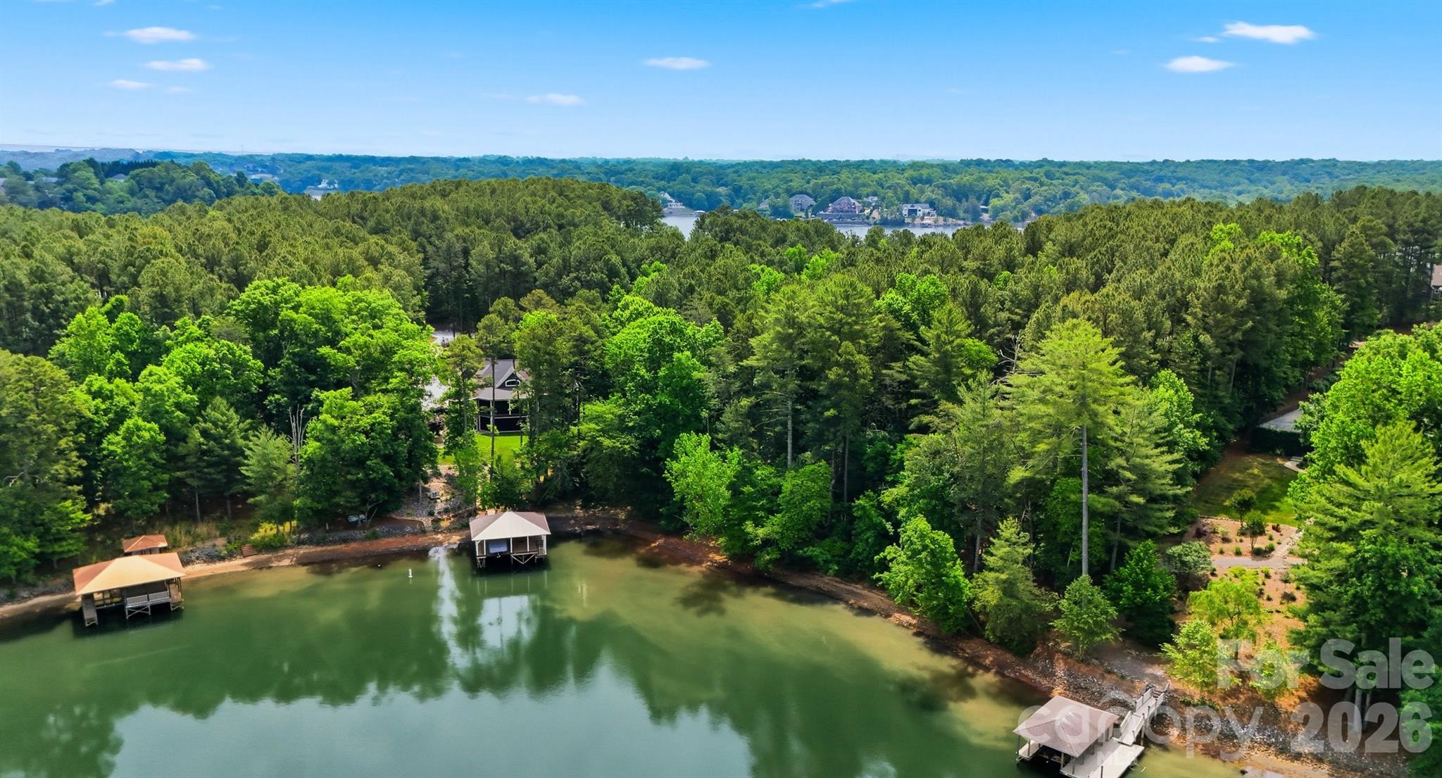 Nestled within the desirable gated community of Plantation Pointe on the shores of beautiful Lake Hickory, this exceptional 1.12-acre waterfront lot offers a rare opportunity to build your dream home in one of the area’s most sought-after lakefront communities. Boasting approximately 146 feet of water frontage, the property showcases breathtaking lake views, peaceful surroundings, and direct access to the lake lifestyle buyers are searching for.
As one of the last remaining waterfront lots in Plantation Pointe, this property presents a unique chance to create a custom residence surrounded by upscale homes and scenic natural beauty. Whether you envision a luxurious primary residence or a relaxing weekend retreat, you’ll enjoy boating, fishing, kayaking, and while creating memories right from your own lakefront home. Located within 15 minutes from downtown Hickory, NC, and all it has to offer with restaurants, a city walk, boutiques and more.  Easy day trips to the Blue Ridge Mountain towns of Asheville, Blowing Rock & Boone as well as just over an hour to Charlotte Douglas Airport.  Opportunities like this on Lake Hickory are becoming increasingly hard to find!!  Don't miss it!