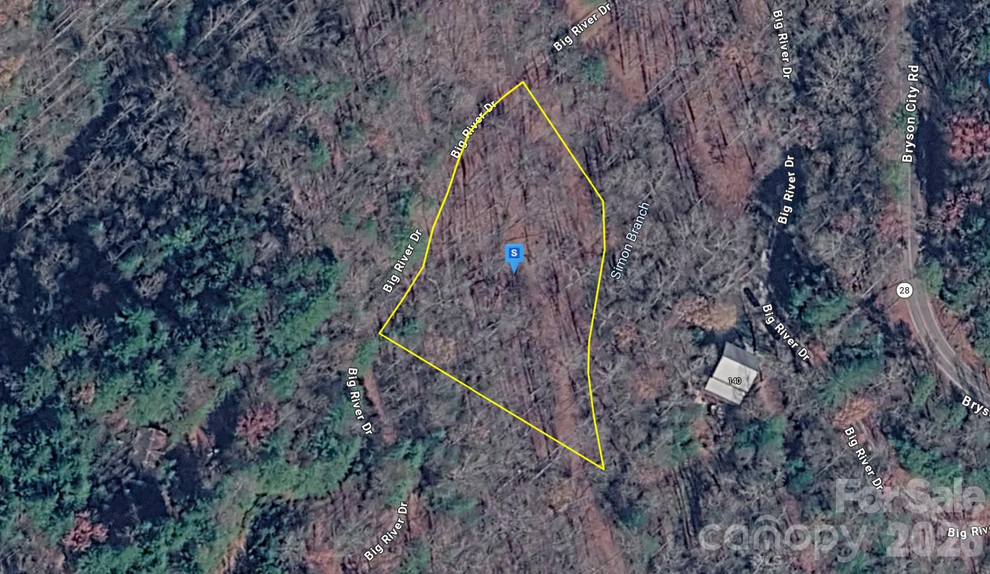 This 1.05-acre lot in the Bryson City area of Macon, NC features wooded, sloped terrain in a mountain setting. Located within a gated HOA community, the property offers privacy, security, and a peaceful atmosphere surrounded by the natural beauty of the North Carolina mountains. The area is known for its outdoor recreation opportunities, scenic views, and convenient access to Bryson City's shops, restaurants, and local attractions. Power is available at the site per seller, adding to the property's potential. Whether you're looking for a mountain retreat or a place to enjoy the tranquility of the region, this parcel offers a great opportunity in a desirable community. Listing is for land only and comes As Is. Street addresses can be for listing purposes only and vacant land will receive a true street address once improved.