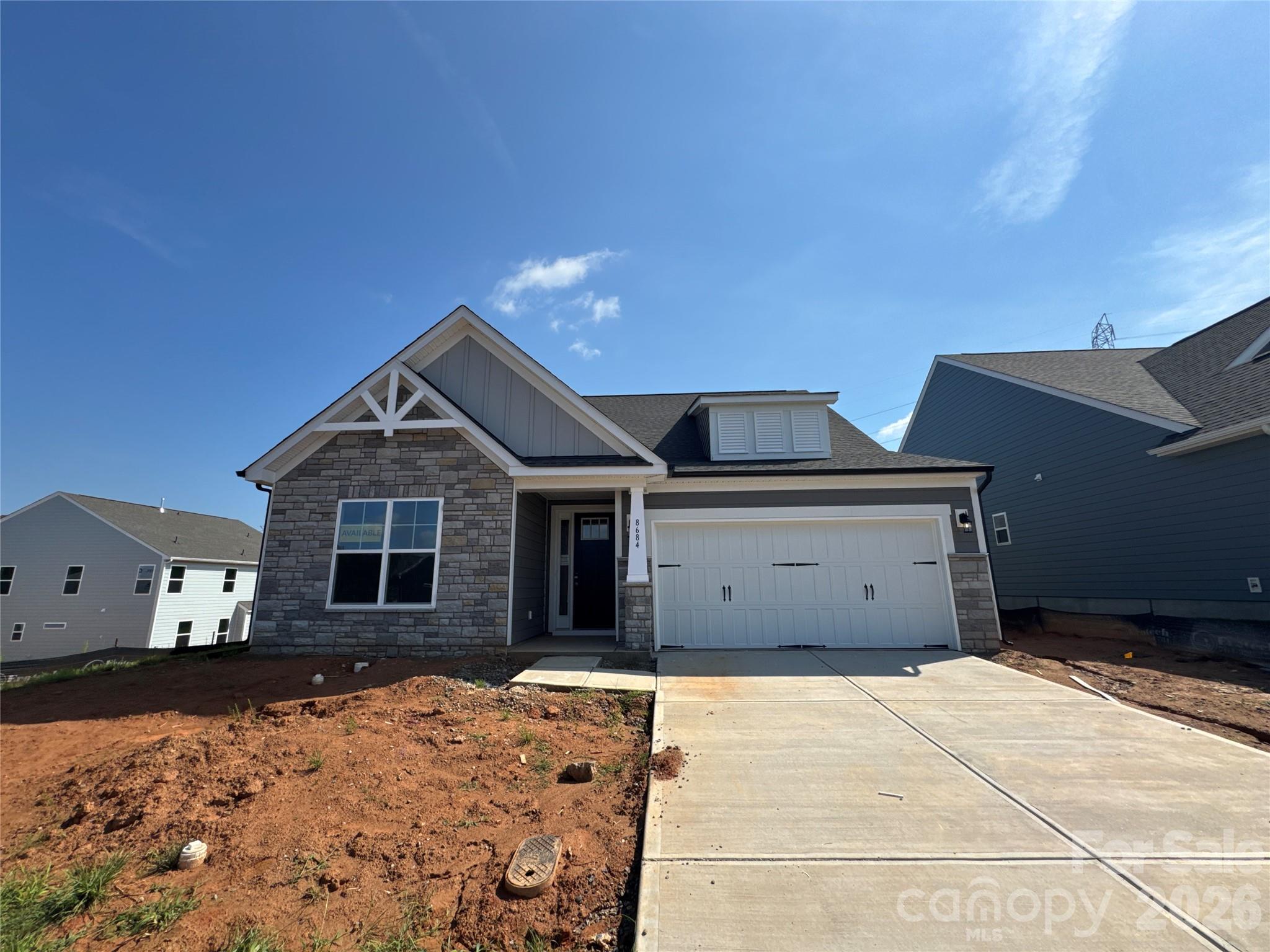 Brand new construction in an amenity-rich community less than two miles from Lake Norman! This 1.5-story Wescott plan has 3 bedrooms, 3 full baths, and more than 2,600 square feet of living space. The kitchen features white cabinets with a contrasting grey island, quartz counters, tile backsplash, a stainless range hood, and stainless appliances, including a gas cooktop. Matching base cabinets, counters, and backsplash extend into the breakfast area to create a buffet, which is perfect for entertaining. The primary suite is on the main has a tray ceiling in the bedroom and a luxury shower in the bathroom. The main floor also includes a formal dining room with tray ceiling, an office with French doors, family room with Cosmo fireplace, a secondary bedroom, a full bath with a 4-ft shower, laundry room, and a mud room with a built-in, beadboard drop zone. The upper floor has a loft, bedroom, and full bath with a tub/shower combo. Community amenities include a pool, cabana, pickleball courts, and pocket parks. Find out more today!