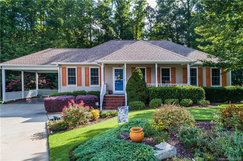 Back on Market at no fault of seller! Come sip on a glass of tea in the 3 seasons room while overlooking the tranquil backyard! No detail was spared in the design including zoysia sod ('16), white stone pathways, and the gorgeous greenery between! Well maintained home with brand new windows throughout!  It's nestled in the back of the neighborhood in the cul de sac with larger lot than most neighbors.
