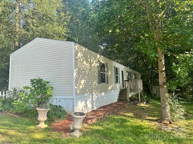 Affordable housing alert! This home is move-in ready! Very private setting. Whether this is your home or investment opportunity, the potential is endless! This model was upgraded with vinyl windows and a hood system. See this home today!