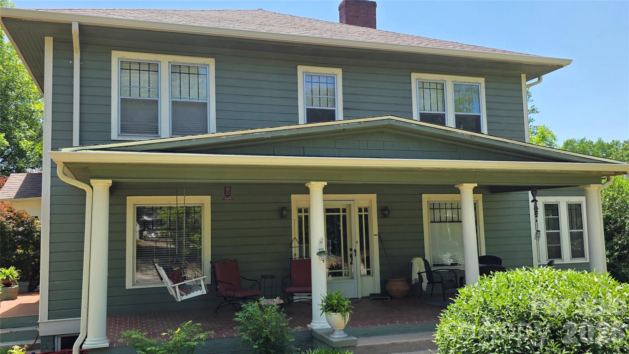 Wow, check out the recent updates....new roof and 6 inch gutters on house, new roof on garage, new stainless-steel refrigerator, facia replaced where needed, top railing replaced on back deck, side door trim to be replaced, new light fixture in primary bathroom. This beauty is standing tall with all of her updates! 

Step back in time with this charming 4BR/2.5BA home built in 1923, once owned by Dr. Cyrus Leslie Walton, who began practicing medicine in Glen Alpine in 1932. Offering 3,006 sq ft of heated space on a .86-acre fenced lot, this home is full of vintage character—original wood floors, high ceilings, and beautiful staircases. The main floor features a spacious living room that opens to a bright sun porch, a large formal dining room, and an office/library. Upstairs, generous bedrooms provide comfort and charm. The 1,554 sq ft unfinished basement offers excellent storage. Enjoy relaxing on the quaint front or side porch, and there’s a detached 2-car garage. There may even be a small creek at the back of the property—but you didn’t hear it from us. 313 E. Main is full of Glen Alpine history and timeless appeal—a rare find for those who value craftsmanship and classic style.