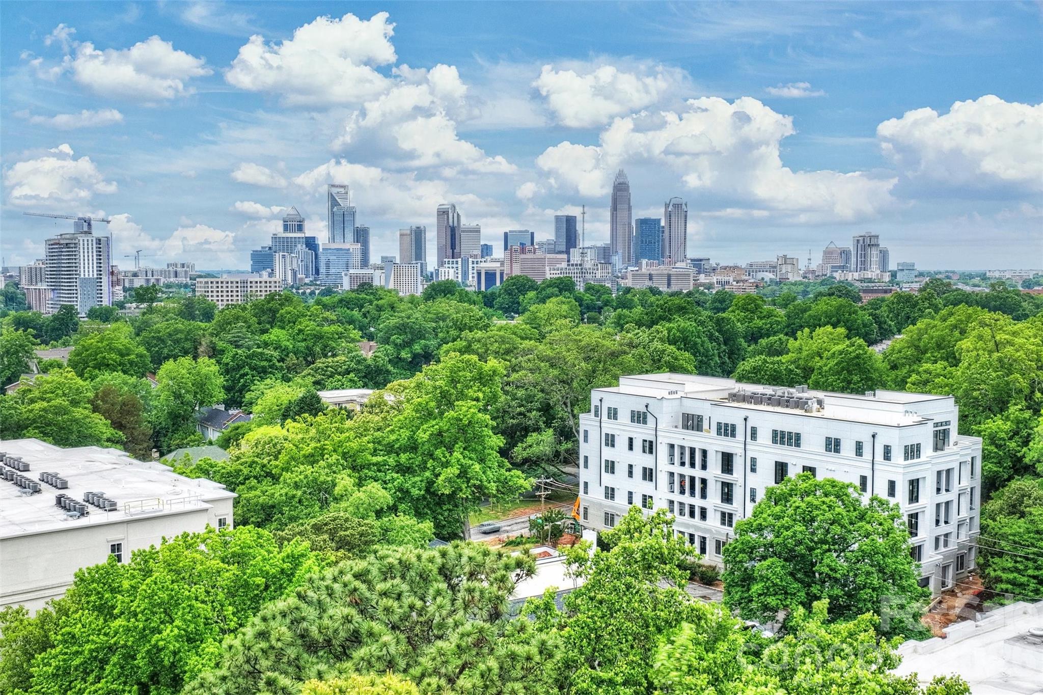 Discover unparalleled luxury and secure, seamless living at 409 Queens, a distinguished collection of 17 single-level residences nestled within Charlotte's most coveted Myers Park neighborhood. This boutique condominium community offers its enviable location, set beneath towering Oak Trees and steeped in historic charm as its premier amenity.Each residence is a testament to sophisticated design, featuring curated and impeccably appointed interiors. Thoughtfully designed floor plans include integrated gourmet kitchens, an expansive great room, a dedicated dining area, and large sliding glass doors that open onto private terraces, extending the living space outdoors.Comfort and privacy are paramount. All bedrooms are equipped with an ensuite bath and generous closet space. Every home is appointed with luxury features, including an outdoor grill, a wine refrigerator, and pre-wiring for an EV charging station.Community amenities further enhance the maintenance-free lifestyle with gated parking, a stylish club room, fitness center and beautifully manicured exterior green spaces, ensuring both privacy and security for residents.