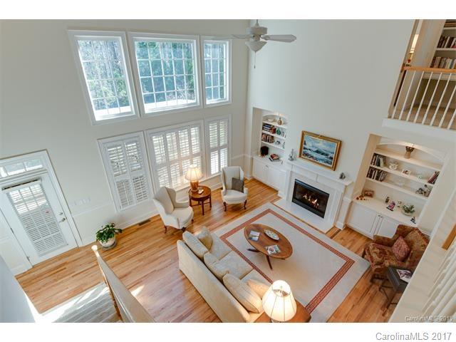 BARGAIN! Ideal if you crave 10 ft Ceilings, 8 ft Doors, Built- ins, Custom Details in every Rm, Study & Master Suite on Main Level, Open Spaces, Little Yard Work, and a Great Location ! Stunning 3 Story Full Brick Home on Private Wooded Lot w/an Oversized Private Screened in Deck. Hardwoods throughout 1st floor. Spacious Gourmet Kitchen, tons of Cabinets/Storage & Pantry , Breakfast Area, Formal Dining, 4 Junior Suites upstairs along w/ an unfinished 3rd floor (plumbed, wired). Visit this week!