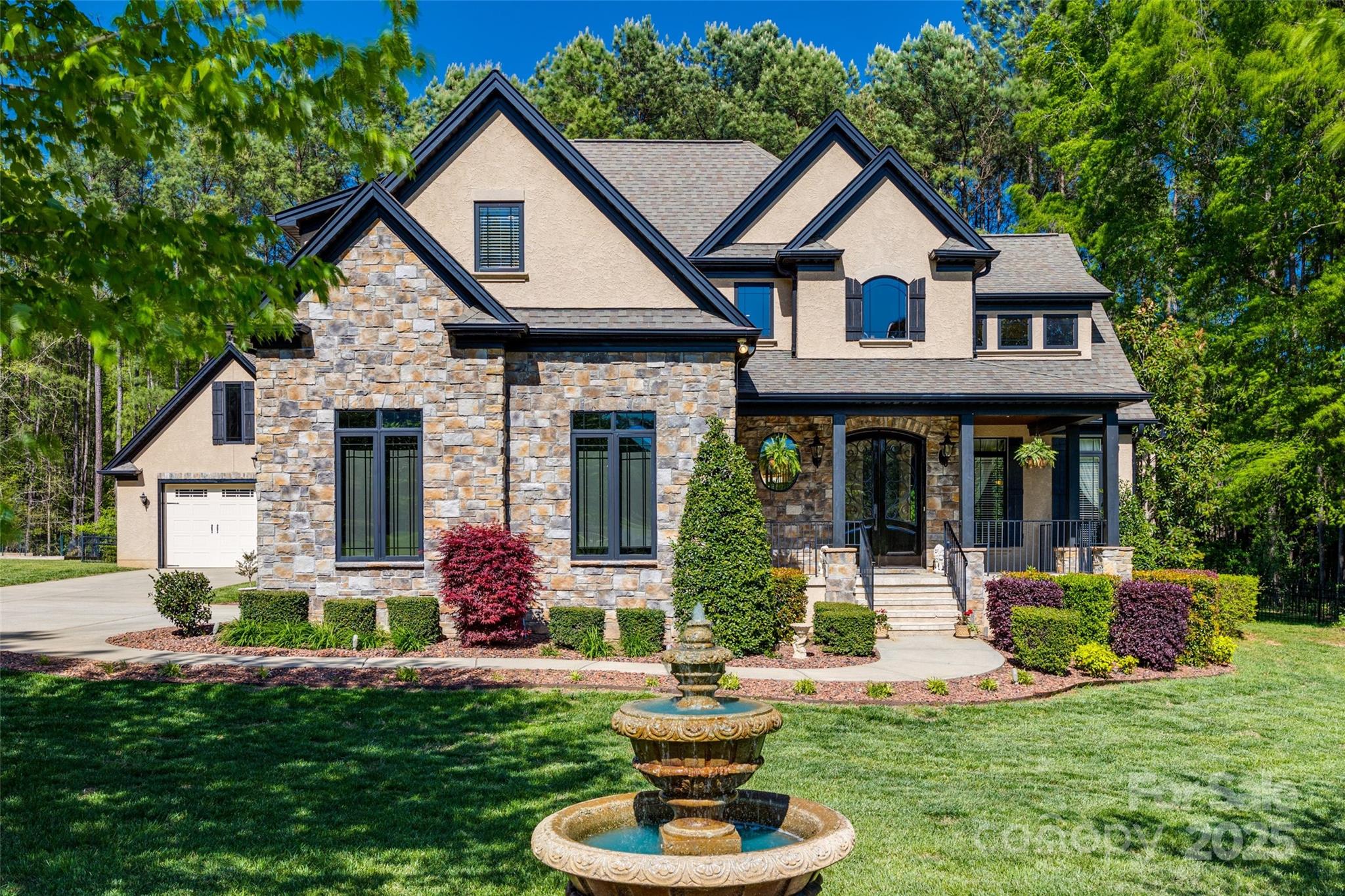 This must see Custom Craftsman- Style home is located in the heart of Lake Wylie, nestled in a private Cul De Sac on 1.276 acres.   Inside the home you will find beautiful crown molding and trey ceilings thoughout. The gourmet kitchen with granite countertops and stainless steel appliances,  opens to a two-story great room featuring a stone fireplace. Enjoy a wine closet off the elegant dining room and a four-season sunroom with a wood-burning fireplace. The primary bedroom on the main floor, offers a spacious walk-in closet, walk-in shower and deluxe bath. Outside, discover an outdoor kitchen, with a Green Egg.  There is a large detached garage, (in addition to an attached garage) ideal for storing a boat or converting into a mini apartment with HOA / County approval as necessary.  Great Location- Close to shopping and restaurants. Award winning Clover School District
The Lot next door is 1.895 acres and is available to purchase separately- MLS  4279785  545 Little Cove Ln