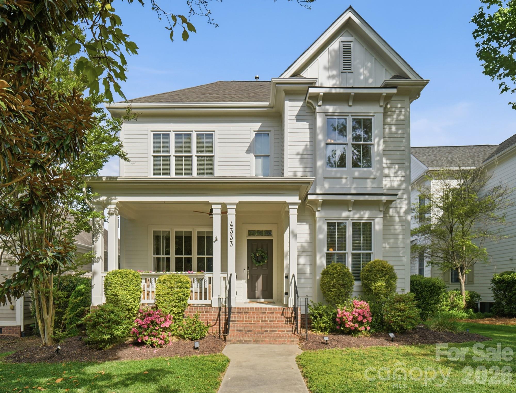 Welcome to 4333 Birkshire Heights, a beautifully maintained Saussy Burbank home in the heart of Baxter Village, just steps from one of the community’s premier amenity centers. Enjoy effortless access to the pool, playground, and scenic walking trails, making it easy to embrace the active, connected lifestyle Baxter Village is known for. 
This 4-bedroom, 2.5-bath home offers over 2,400 square feet of thoughtfully designed living space, featuring classic updates and an inviting open floorplan. The main-level primary suite provides comfort and convenience, while upstairs you’ll find a versatile 4th bedroom/bonus space complete with a private office or hangout area, perfect for today’s flexible living needs. Relax on the charming covered front porch or enjoy outdoor living on the patio, all while being just a short stroll from everything that makes Baxter Village so special. Located in the highly regarded Fort Mill School District, this home offers access to some of the area’s top-ranked schools. Fantastic location and just a short drive to Uptown Charlotte, giving you convenient access to dining, entertainment, and everything the city has to offer while enjoying the charm of Baxter Village. This is a fantastic opportunity to own a home where lifestyle, location, and convenience truly come together.