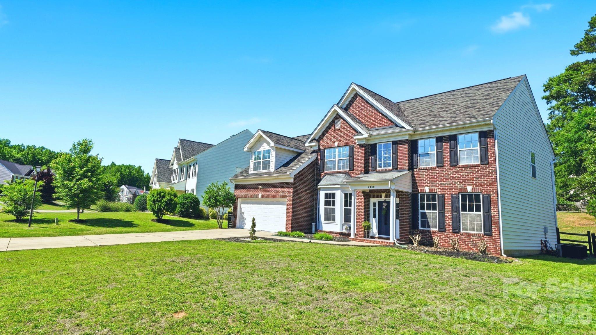 $4,000 lender incentive + free appraisal available through the preferred lender! Funds may be used toward closing costs, prepaids, or a rate buy-down. Close in as little as 21 days if you'd like!

Welcome to this spacious 5-bedroom, 2.5-bath home in the highly desirable Legacy Park community of Indian Land. Offering 2,940 square feet, this well-designed home features multiple living spaces, an open-concept layout, and the flexibility today’s buyers are looking for.

The main level features a flexible bedroom/flex space ideal for guests, a home office, playroom, or additional sitting area, along with a large family room showcasing soaring ceilings, abundant natural light, and a cozy fireplace that creates a warm and inviting atmosphere. The oversized kitchen offers ample cabinetry, generous counter space, a large dining area, and an open flow ideal for everyday living and entertaining.

Upstairs, the oversized primary suite serves as a true retreat with enough space for a sitting area, office setup, or additional lounge space. Four additional bedrooms provide flexibility for guests, hobbies, remote work, or multigenerational living.

Step outside to a private, tree-lined backyard with added privacy and outdoor entertaining potential. The outdoor seating area and pergola provide inviting spaces to relax or gather with family and friends.

**ADDITIONAL FEATURES & UPGRADES**

• Bluetooth speakers installed in all bathrooms
• Bluetooth-enabled exterior flood lights
• Motion-detection kitchen lighting that automatically activates upon entry
• Upgraded light fixtures throughout the home
• Ceiling fans controlled by remote controls
• Gazebo fan controlled by remote
• Bluetooth-enabled gazebo lights

Located just minutes from shopping, dining, Ballantyne, and Charlotte, Legacy Park residents enjoy community amenities including a pool, clubhouse, playground, and walking trails.