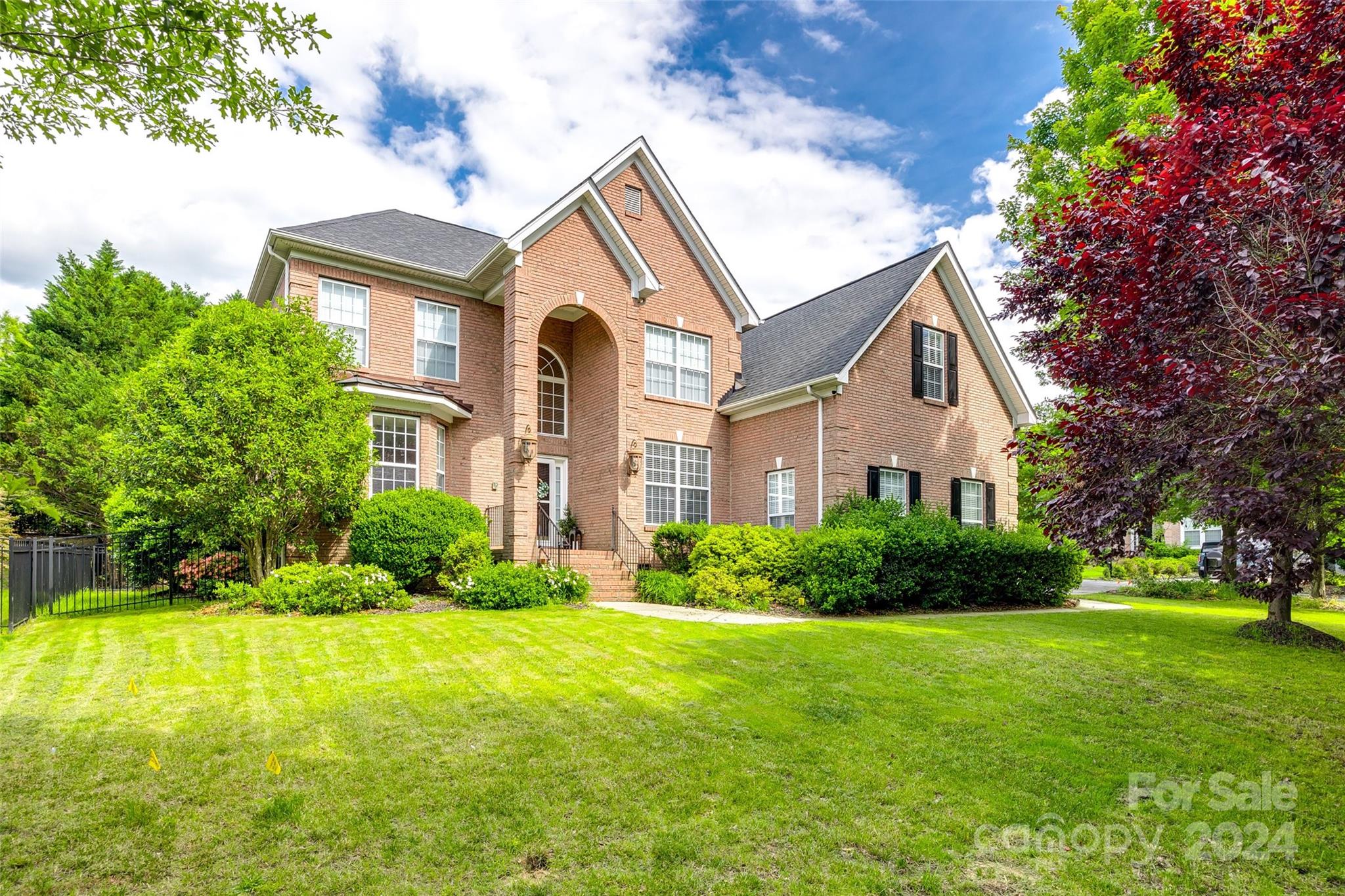 STATELY...IMPRESSIVE...PRISTINE...SHOW-STOPPING...the list goes on! Gorgeous ever popular floor plan in the highly sought after section of Lake Shore! This FULL BRICK home boasts a beautiful neutral color palette that provides a soothing & calming welcome home. Private primary suite has a renovated spa-like bath w/dual vanities, separate water closet, freestanding tub & shower amidst an enormous walk-in closet. Soaring 2-story foyer is flanked by a home office w/ french doors for privacy & formal DR. True finished onsite hardwoods guide you into the expansive 2-story great rm featuring a wall of floor-to-ceiling windows & gas-log FP. The kitchen has a generous supply of painted cabinets, solid surface counters & upgraded tile backsplash. Upstairs, take the catwalk to find three secondary bdrms & 2 full baths. Versatile flex space off bonus can be used for a craft rm, 2nd office or simply storage.  Spend quiet evenings on the rear deck, perfect for al fresco dining, entertaining & more!