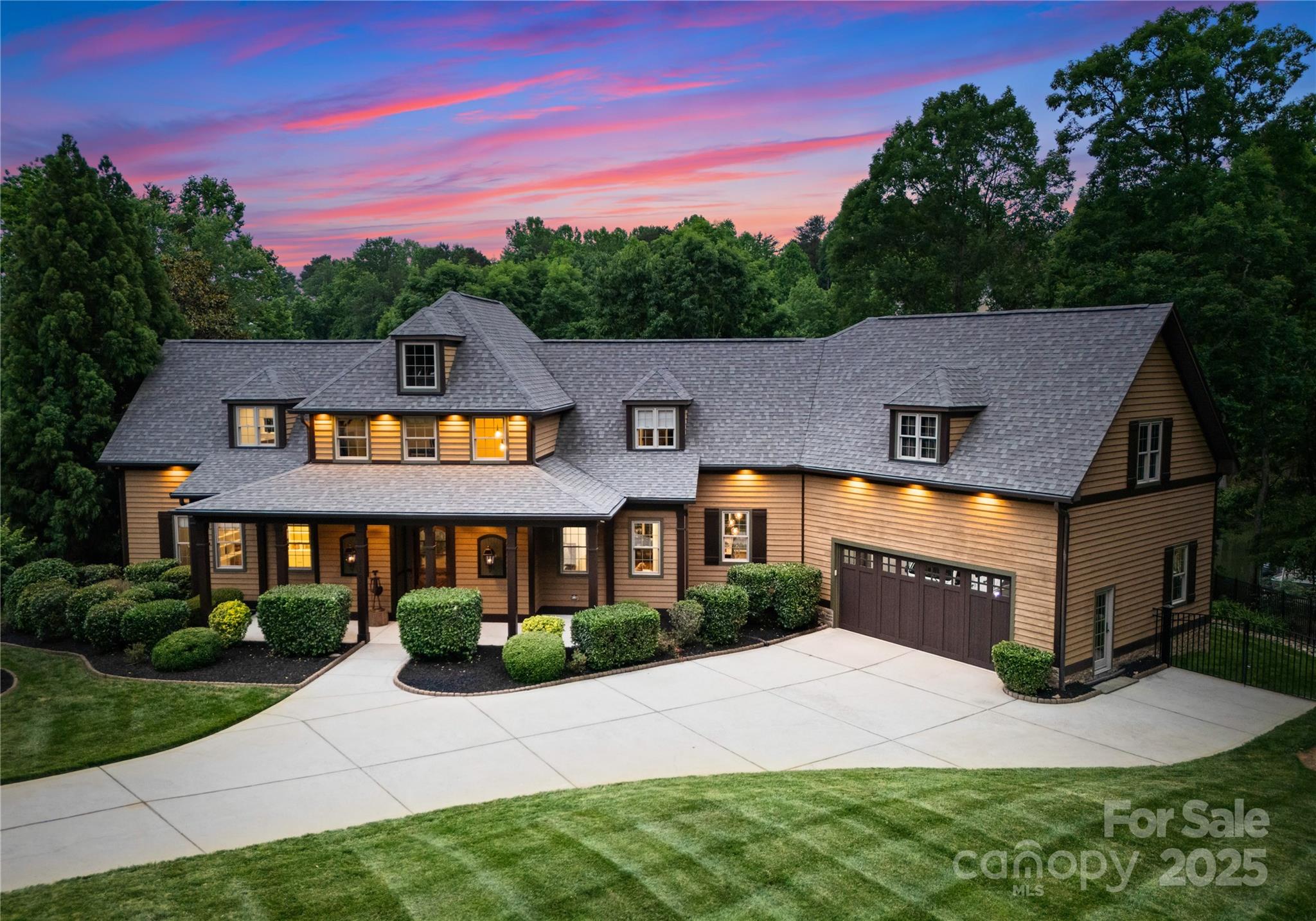 Live the Lake Norman lifestyle in this exceptional waterfront retreat, crafted for elevated entertaining & effortless relaxation. A private dock with covered boat slip sets the stage for life on the water, while the sparkling pool & spa, outdoor fireplace, putting green, & expansive deck offer resort-style living at home. The open floor plan showcases rich hardwoods, a gourmet kitchen with large island, high-end appliances, bar, pizza oven, and an inviting wine cellar & tasting room with beer taps as well. Two luxurious primary suites—one on each level—offer flexibility and comfort. A custom stone fireplace anchors the covered sitting area, perfect for year-round gatherings. Movie nights await in the dedicated theater room, and an abundance of storage ensures everything has its place. With exceptional indoor and outdoor living, thoughtful design, Control4 smart home technology and every amenity at your fingertips, this rare Lake Norman offering is as functional as it is unforgettable.