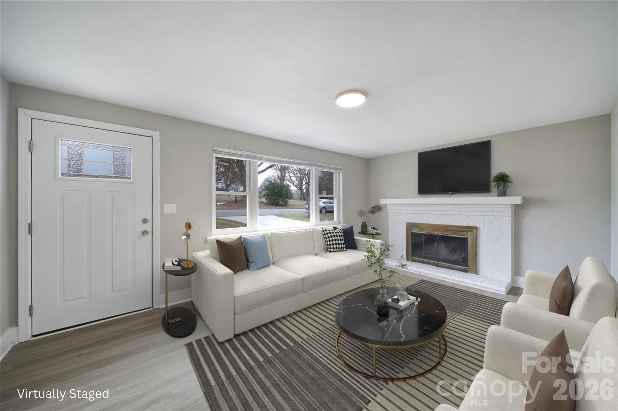 This solid 3-bedroom, 2-bath home has been updated and is ready for it's new owner. The living room has space to spread out plus a wood-burning fireplace for a cozy evening in. The kitchen features brand new stainless appliances, new cabinets, subway tiles backsplash and quartz countertops, and a walk in pantry and separate laundry room. The primary bedroom with ensuite features a custom subway tile walk-in shower, new vanity, toilet, and fixtures. Brand new LVP runs throughout the main areas and both bathrooms, with new carpet in all 3 bedrooms. The hallway bathroom has also been completely revamped with a subway tile tub surround, new vanity, fixtures and toilet. Also new paint inside AND outside, giving the house curb appeal on the outside and a fresh, crisp vibe on the inside. The roof was also replaced in 2025 along with the exterior doors, light fixtures, and most of the plumbing pipes have been converted to pex. Out back, you’ve got a large yard with room to play, grill, or let the dog run. The location is very desirable and perfectly situated with quick access to I-85, just 5 miles to Uptown Charlotte, NoDa & Plaza Midwood, and just 6 miles to the airport. Don't let this one get away!
