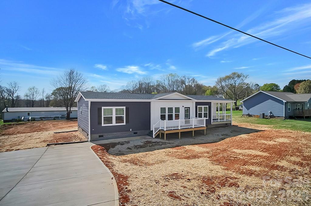 BACK ON THE MARKET - No Fault of the Seller! Welcome to this beautifully appointed 2025 Clayton double-wide home, originally designed and showcased as the model—featuring premium upgrades, thoughtful design, and exceptional attention to detail throughout. Situated on a spacious 0.45-acre parcel, this property offers the perfect combination of modern comfort and room to enjoy the outdoors.

Step inside to an open-concept floor plan filled with natural light, enhanced by high-end finishes, stylish fixtures, and a welcoming atmosphere. As a former model home, it comes partially furnished with professionally selected décor, making it truly move-in ready and ideal for buyers seeking convenience and style.

The kitchen is designed to impress with contemporary cabinetry, sleek countertops, and modern appliances, seamlessly connecting to the living and dining areas—perfect for entertaining or everyday living. The primary suite provides a relaxing retreat with a private en-suite bath, while additional bedrooms offer flexibility for guests, family, or a home office.

Outside, the generous 0.45-acre lot provides plenty of space for outdoor living. Whether you’re looking for a primary residence or a turnkey investment opportunity, this property stands out with its model-home quality and included furnishings.