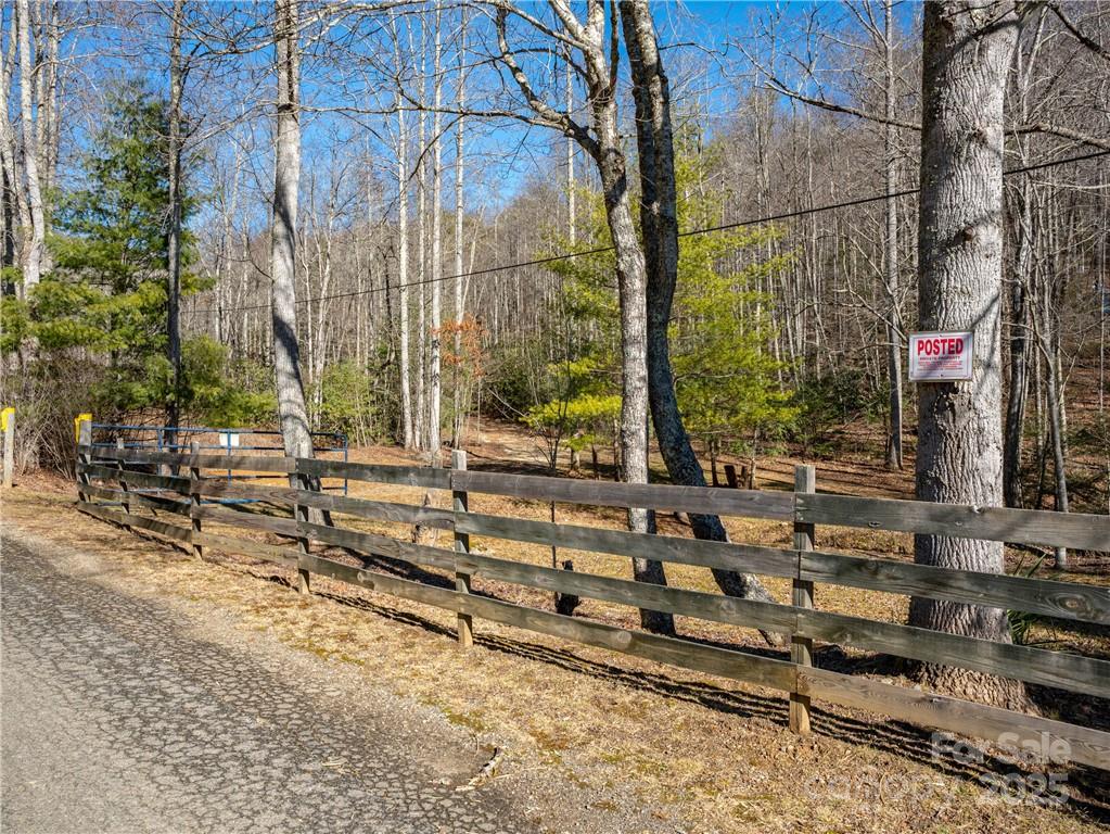 Beautiful mountain property with rambling creek in the Bee Tree area; this unique land gently slopes as you hike up to higher elevations providing mountain views;  Explore the many possibilities available- mini farm, gardening, vacation home(s); Privacy, views, and a flowing creek await- all in a convenient location. Come tour this wonderful property and imagine the possibilities! *Minimal restrictions located in attached deed. **Subject property is a portion of a larger tract and no separate tax value has been given.  Tax Value will be determined at/after closing by Buncombe County.