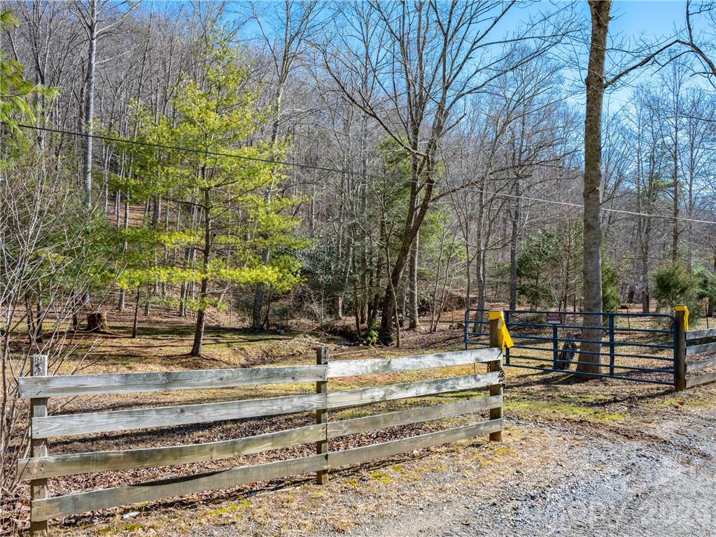 Beautiful mountain property with rambling creek in the Bee Tree area; this unique land gently slopes as you hike up to higher elevations providing mountain views;  Explore the many possibilities available- mini farm, gardening, vacation home(s); Privacy, views, and a flowing creek await- all in a convenient location. Come tour this wonderful property and imagine the possibilities! *Minimal restrictions located in attached deed. **Subject property is a portion of a larger tract and no separate tax value has been given.  Tax Value will be determined at/after closing by Buncombe County.