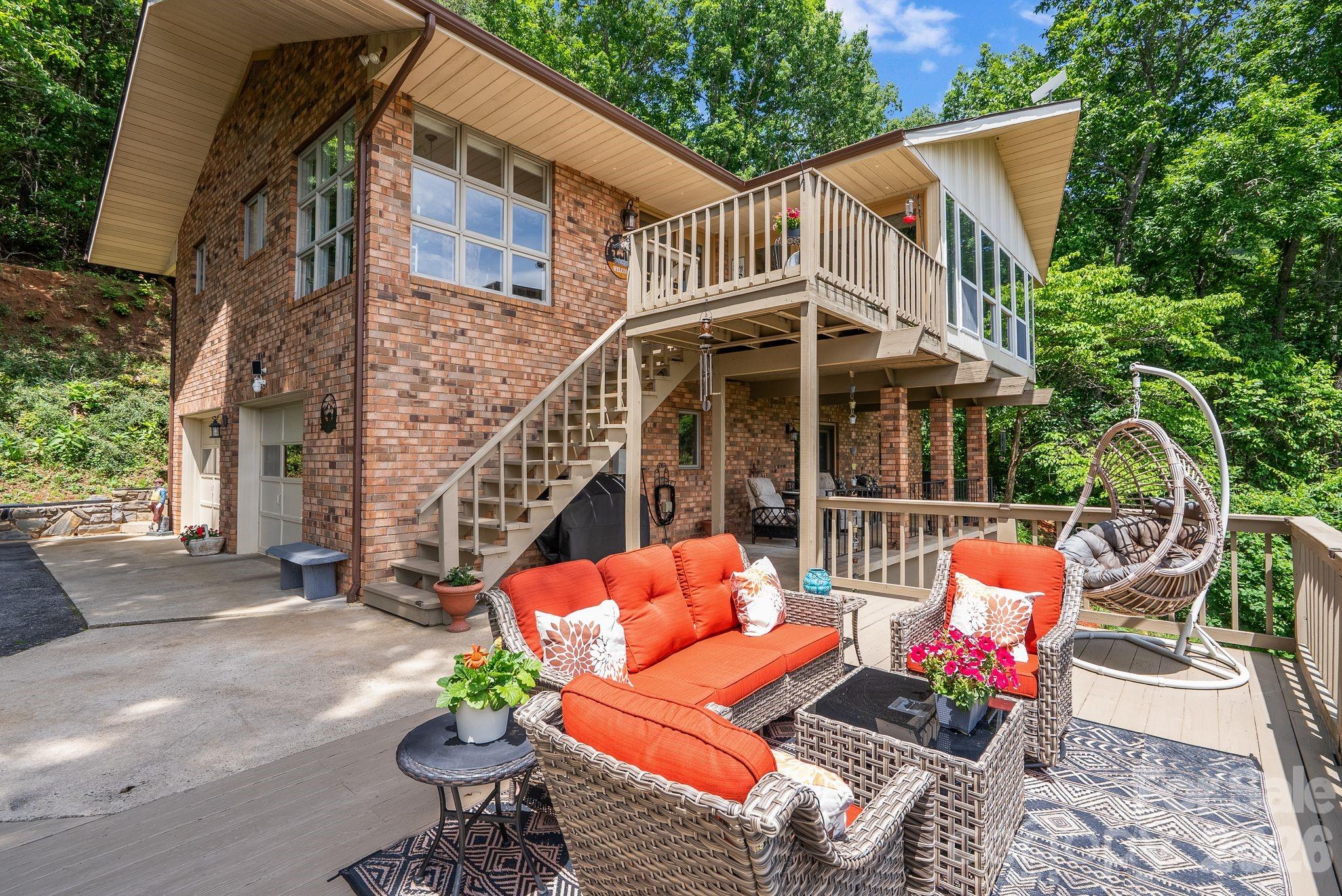 ***Stunning Year-Round Mountain Views
***Gated Golf Course Community
***Spacious Kitchen/stainless steel appliances
***Sunroom
***2 Decks***

Beautiful mountain retreat nestled on 4 private acres at the edge of Springdale Estates, offering breathtaking year-round views and the peace and tranquility that make Western North Carolina living so special. Surrounded by nature and mountain scenery, this inviting home blends comfort, privacy, and exceptional indoor/outdoor living. The spacious, well-appointed kitchen with breakfast nook is filled with natural light from floor-to-ceiling windows that frame panoramic mountain and treetop views. The living room flows seamlessly into the expansive all-weather sunroom featuring three walls of glass, creating the perfect place to enjoy morning coffee, brunch with friends, or cozy evenings by the fireplace while taking in the surrounding scenery.
Multiple covered and uncovered decks provide exceptional outdoor living and entertaining spaces, including a firepit area ideal for relaxing under the mountain sky. With 3 bedrooms and 2 bathrooms, the home offers comfortable living for both full-time residence and mountain getaway.
Just beyond the driveway, Springdale Estates begins, and a quick 5-minute golf cart ride brings you to Springdale Resort amenities, including the 18-hole golf course, Pro Shop, Rocky Face Tavern, 24/7 fitness center, pool, hot tub, event center, and Welcome Center.
Springdale Resort Membership Initiation Fee included with acceptable offer