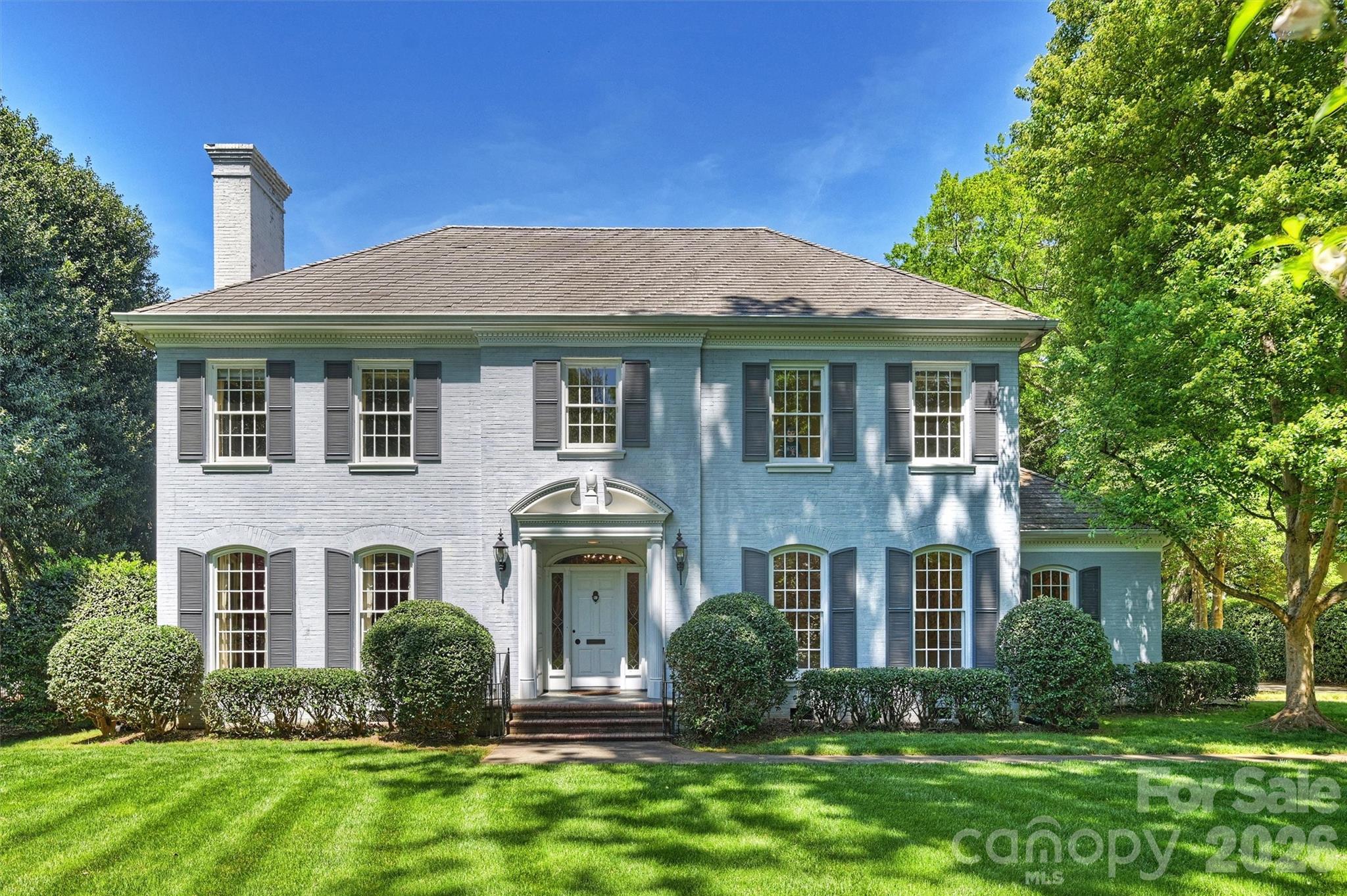 Nestled in the heart of Myers Park, just two doors from the iconic Duke Mansion, 812 Ardsley Road presents one of the rarest opportunities remaining in this coveted neighborhood. Set on an extraordinary .75-acre lot, the property offers a perfectly flat, completely private and quiet backyard framed by mature trees, lush landscaping, and blooming azaleas. The setting is truly exceptional. The home itself is rich with character and timeless appeal, featuring gracious living spaces, high ceilings and classic stately curb appeal. This is a remarkable chance to restore and reimagine a special home on one of Charlotte’s most treasured streets. Welcome home!