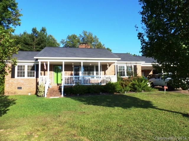 Just minutes from the golf course. All brick, lovely, updated & move in ready ranch home. Lg family room w/built ins, FP/gas logs, fml dining room, updated kitchen, 3 BR's, 2BA's, replacement windows, updated roof, gas pack, carport & lg deck.  Detached wired workshop w/ 1/2 bath, perfect for the man of the house. (Sold AS IS)