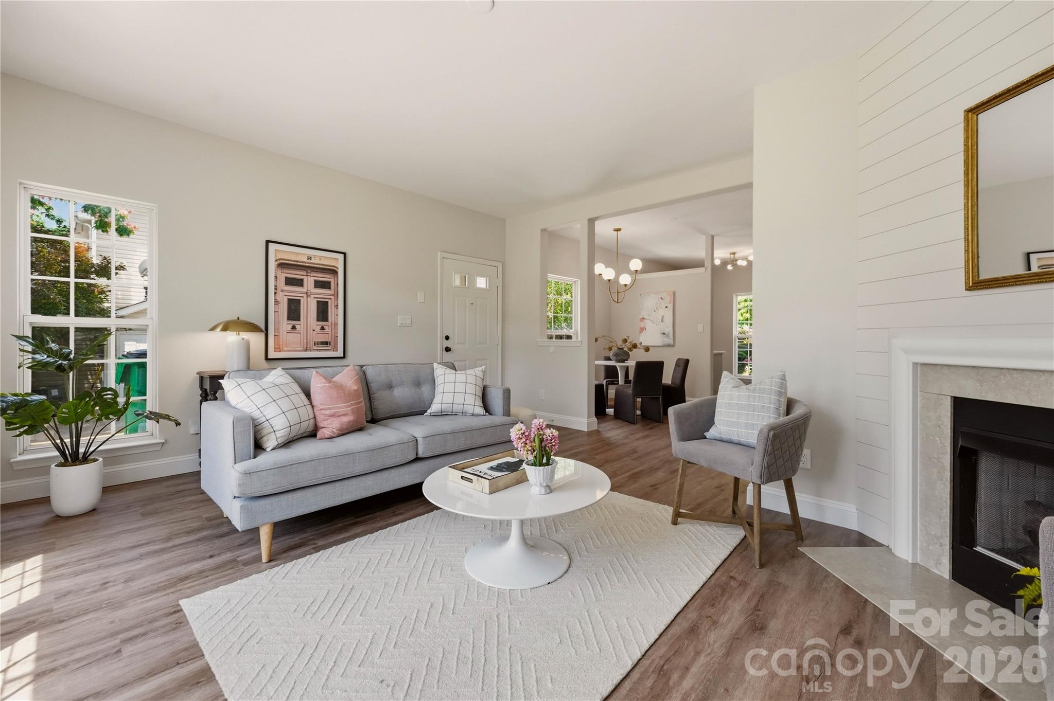 Fresh finishes, dual en-suites and summer by the pool? Yes, please! Step inside this beautifully updated end unit town home and you'll find brand new luxury vinyl plank flooring, Quartz countertops, new cabinetry, stainless steel appliances, gorgeous new lighting, new carpet and fresh paint throughout, giving the entire home a bright modern vibe! The floor plan is fantastic! The main level has a den and a living room, giving space for everyone! The ideal floor plan continues upstairs, with two true en-suite bedrooms, each featuring its own private bath. The spacious primary suite includes two closets (Yes, please!), while the second suite offers the same privacy and comfort that's perfect for guests, roommates, a home office or gym with its own dedicated bath. Step outside to your private patio, the perfect spot for morning coffee, evening cocktails, or convincing yourself you'll start that container garden this year! Relax, don't lift a finger and let the HOA take care of the lawn maintenance! Escape the summer heat, grab your favorite floatie and pop over to the community pool for a cool dip! Common Market, Night Swim Coffee, The Teal Turnip and The Health Club are a hop and a skip away! Cotswold is just around the corner and the commute to Uptown is a breeze! Welcome Home!