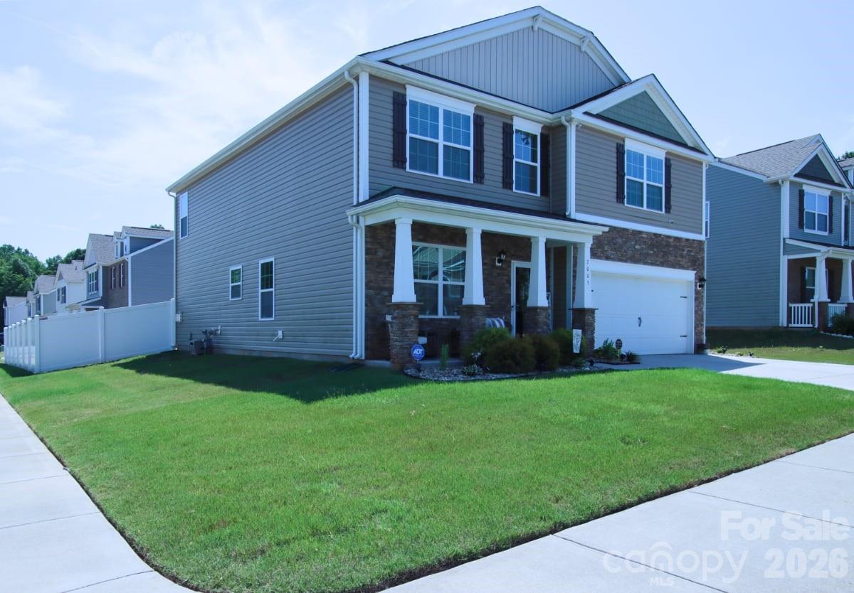 Welcome to 2005 Mariah Glen Court, a 4-bedroom, 2.5-bath home located in The Reserve at Austin Estates. Built in 2022, this move-in ready home offers 2,824 square feet of living space on a corner lot with a 2-car garage. The main level features a dedicated office, a spacious open-concept layout, and a family room with a fireplace that flows into the dining area and kitchen. The kitchen includes a center island, breakfast area, and ample cabinet and counter space, making it well-suited for everyday living and entertaining. A convenient half bath completes the first floor. Upstairs, a versatile loft provides additional living space for a media room, play area, or home office. The primary suite features an ensuite bath and walk-in closet. Three additional bedrooms offer generous space and share a full hall bathroom. Conveniently located near the UNCC area, I-485, shopping, dining, and entertainment, this home combines modern construction, functional living spaces, and easy access to everyday amenities. Schedule your showing today.