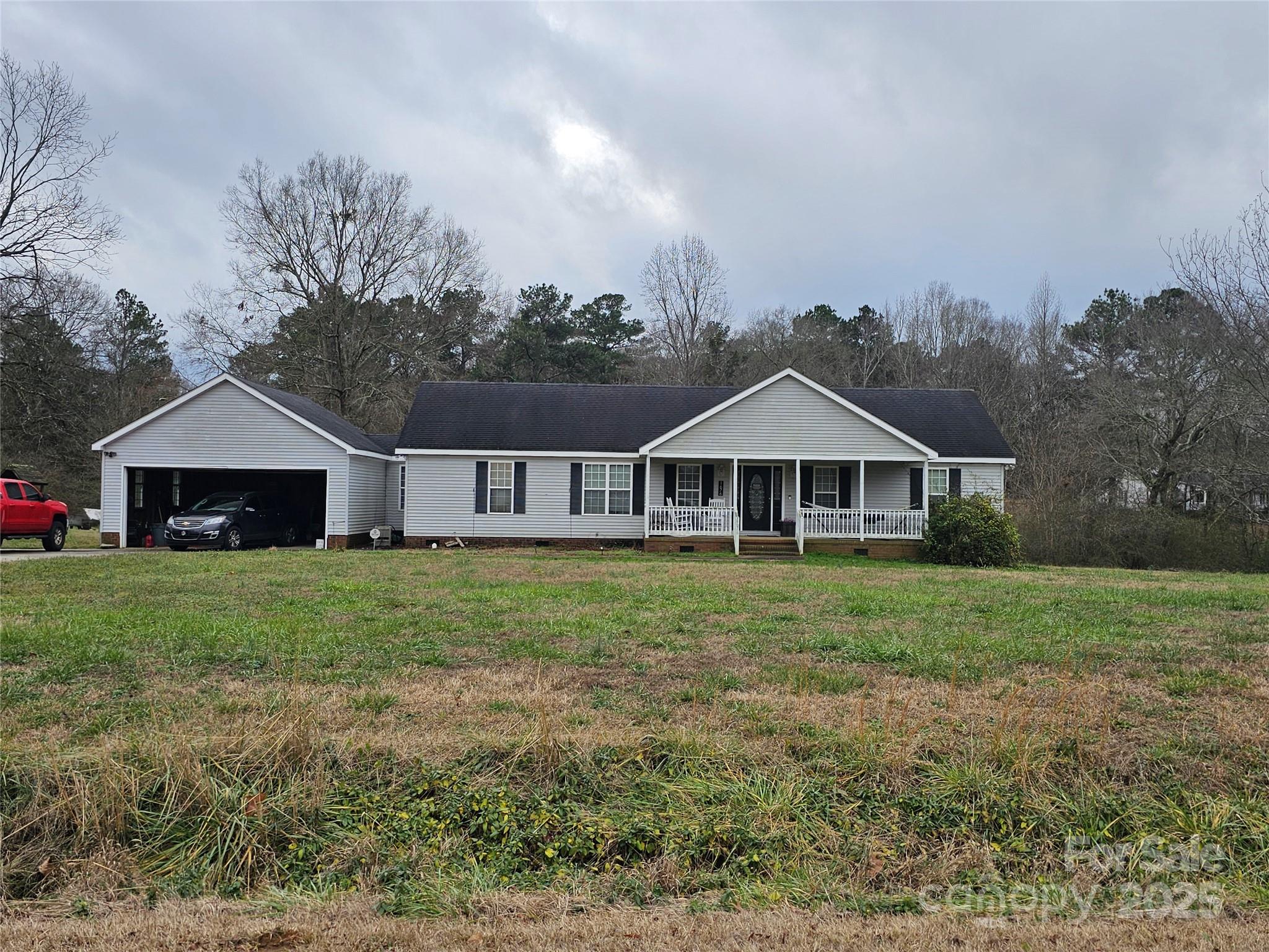 Come and see all this home has to offer.  This 3 bedroom 2 bath is situated on 2.25 acres.  Has a welcoming front porch, split floor plan.  Large living room, kitchen with lots of cabinets and dining area that has sliding glass doors that open onto a deck. Home has an attached 2 car garage.  Home is being sold as is. Needs HVAC and new roof.