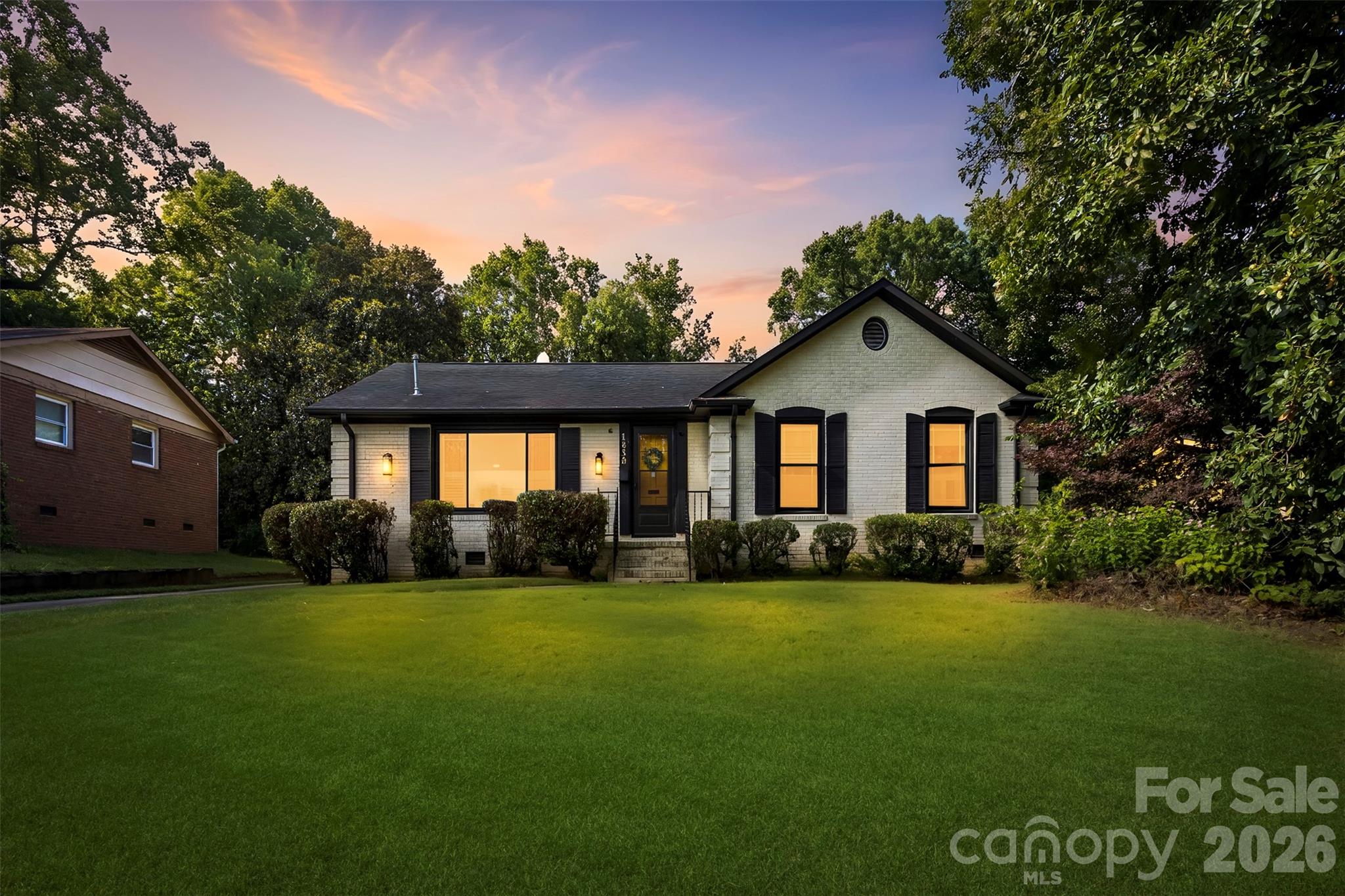 Just minutes to Uptown Charlotte! A couple of turns out of the neighborhood and you see the Beautiful Charlotte Skyline! This one-level brick home offers charm and curb appeal. 3 Bedrooms / 2 full baths. Kitchen features stainless steel appliances, white subway backsplash, stylish blue cabinetry. An enormous pantry with amazing built in's and storage. Hardwood floors. Easy to stay organized with one bedroom having storage system already installed. Tankless water heater (2020 per seller). HVAC (2025 per seller). Refrigerator, washer and dryer included. Back patio is perfect for entertaining, along with a large backyard. 2-car carport with a large wired storage area attached. Driveway with ample parking. This home was once utilized as a sucessful AirBNB! So whether you are looking for a home or an investment, this is a great opportunity of potential! Close to I-85 and everything Charlotte has to offer!
