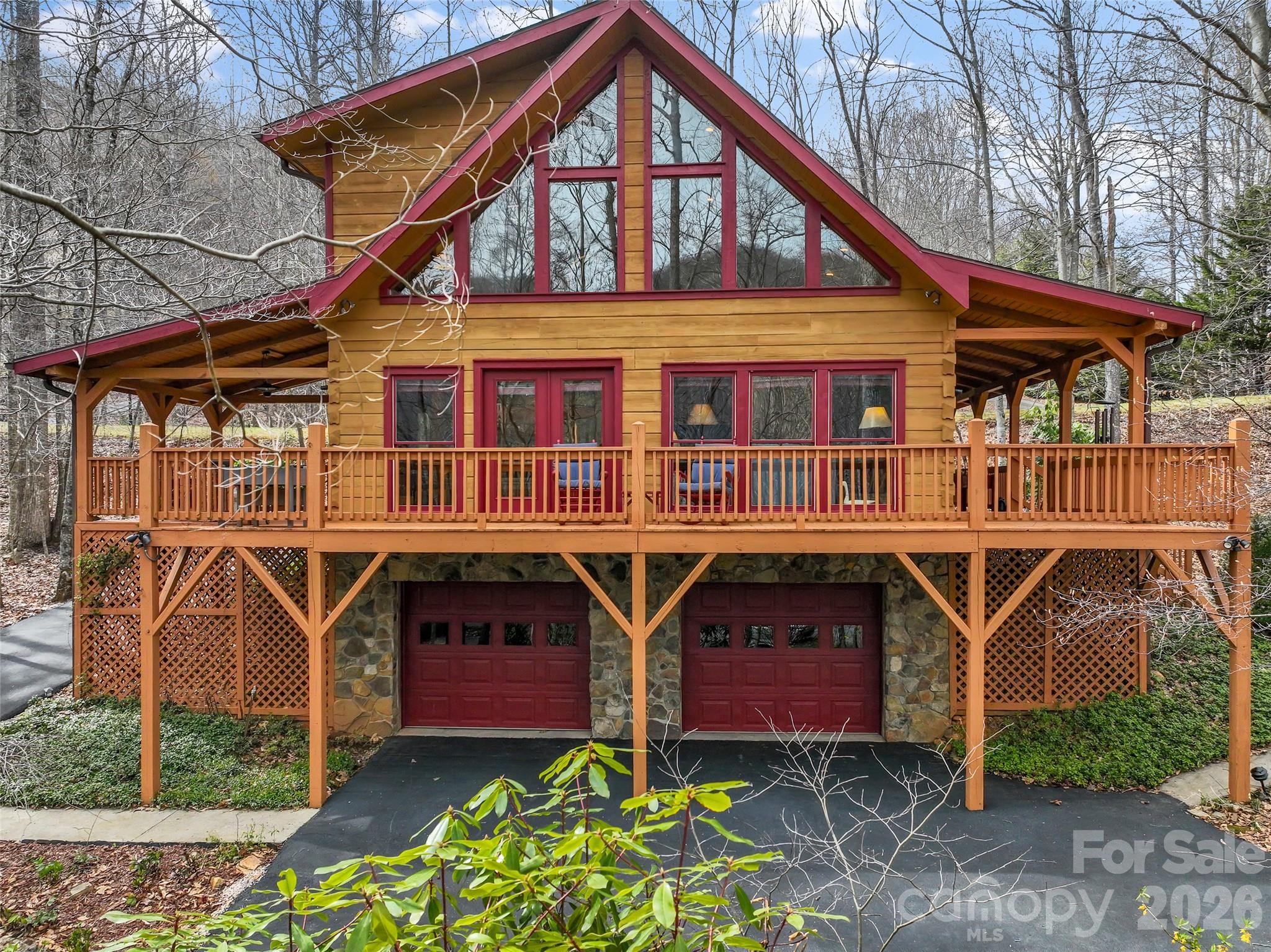 Experience a lifestyle that offers the perfect harmony of serene, rustic charm and suburban convenience. This picture-perfect log home provides a true retreat, allowing you to wake up to the sound of birdsong rather than traffic. You can start your morning on the porch and still enjoy a quick trip to South Asheville’s premier shopping, dining, schools, and businesses, as well as nearby recreation at the Arboretum and along the French Broad River. 

Approaching the home, a paved, forked driveway offers dual-access options: take the lower path to the secure, stone-accented two-car garage, or follow the upper path for a direct, level-entry arrival to the main floor. The floor plan is meticulously designed, prioritizing the convenience of main-level living without sacrificing space. The log construction of this home serves as a sanctuary of comfort, providing a sense of warmth and security that is difficult to find in conventional construction. 
. 
The heart of the residence is a sun-splashed great room and dining area anchored by a stacked-stone gas fireplace and multi-tier, southeast-facing windows that frame tranquil woodland views.The open layout provides an effortless transition to the kitchen and dining areas, making it ideal for both quiet evenings and hosting guests.

This kitchen perfectly balances rustic timber beams with sleek, stainless steel appliances, quartz countertops, and a designer light fixture. The oversized island provides plenty of prep space and a social hub for the home, making it as functional as it is beautiful.

Positioned on the main level for maximum accessibility, the primary bedroom features an integrated ensuite bath and a spacious layout. The room is anchored by beautiful wood ceilings and a cooling fan, offering a quiet, functional escape tucked away from the main living areas.

The upper level offers a unique and versatile retreat. In addition to the large, primary-sized bedroom and full bath, a spacious loft nestles at the apex of the gabled roof windows; this private "treehouse" is perfectly suited for a home office, an inspiring library, or a playroom.

The lifestyle extends outdoors to an expansive wrap-around deck and a covered porch where you can fully immerse yourself in the beauty of the forest.  

The heated basement provides plentiful storage and could easily transform to a workshop.

Situated within an upscale, 300-acre gated community with 22 acres of common area, the neighborhood feels like a dedicated nature preserve.

Life in Avery Park isn't just about the privacy—it’s about the community, too. Residents enjoy exceptional amenities, including an outdoor swimming pool, community garden, stocked pond, and playground, as well as a tennis court that conveniently doubles as a pickleball court. Whether you’re looking for a morning match or a summer afternoon dip, it’s all just minutes from your front door. Adventure is truly at your doorstep with direct access to the Pisgah National Forest and the National Park trail system. 

Here is the rare opportunity to start your day in the deep woods, dine at one of the 15  Asheville restaurants included in the Michelin Guide, and finish it at one of the five best small rock and roll venues in the nation. This isn't just a home; this is LIFE as you want to live it.