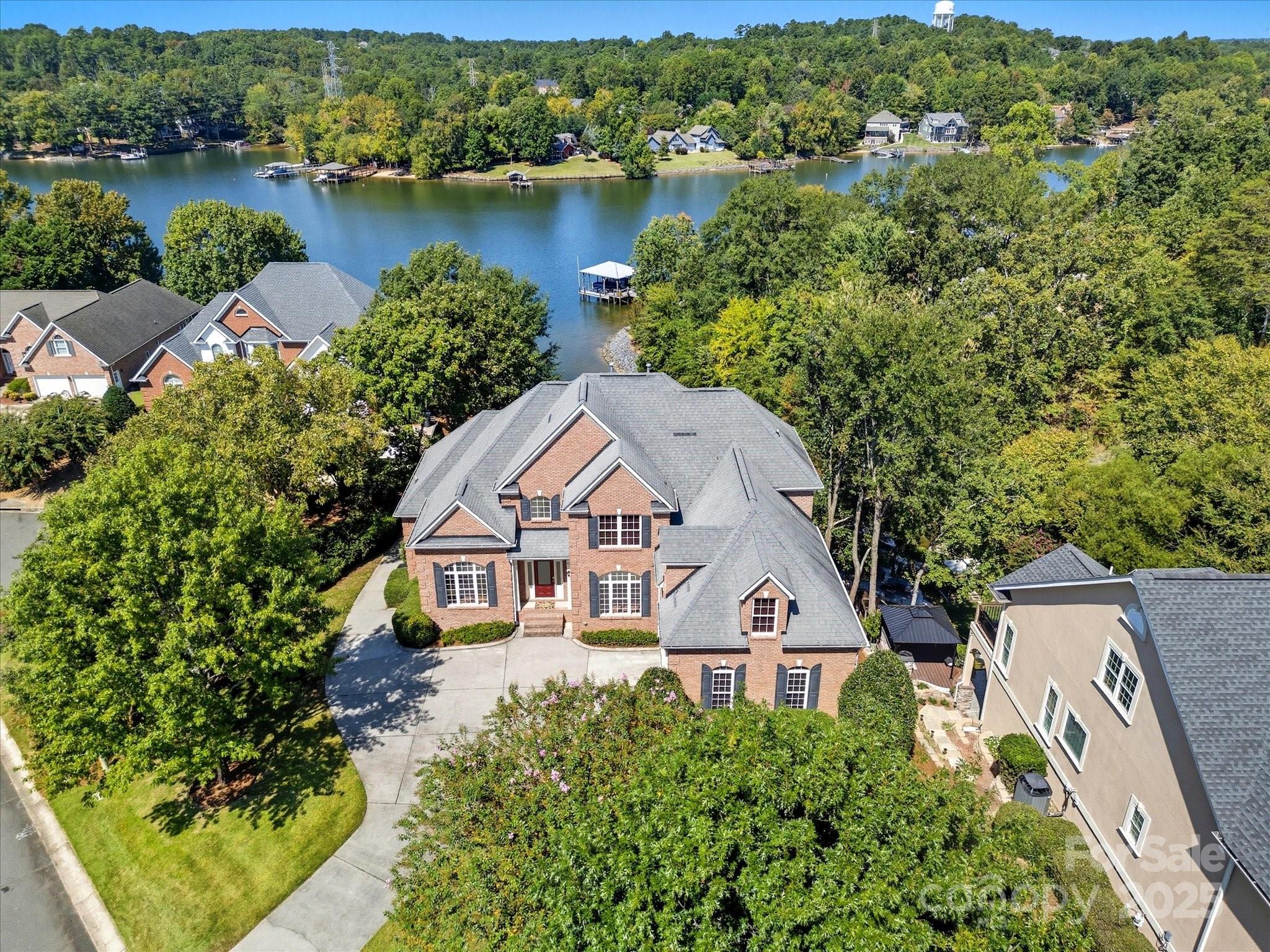 You still have time to celebrate the Christmas holiday in this amazing lakefront home! Enjoy a deep Black Friday price reduction—the perfect opportunity to secure the ideal combination of water, luxury, space, and location. This stunning lakefront property truly has it all: gorgeous waterfront views, a private boat dock with boat lift and expandable jet ski dock, full brick exterior, a newer build (2006), abundant storage, a home gym, an open and airy layout, and access to highly sought-after Fort Mill schools.

Welcome to 524 River Lake Court—a beautifully maintained custom home offering 5+ bedrooms and 4 bathrooms, tucked away in a quiet, picturesque neighborhood just off Dam Road. The location is unbeatable, only minutes from shopping, restaurants, hospitals, schools, and major highways. Step inside to a grand two-story foyer leading to a spacious dining room with tray ceiling and detailed molding, a large office with a striking palladium window, and an inviting family room showcasing expansive lake views. Whether you’re enjoying morning coffee on the covered porch that feels like a peaceful mountain retreat, or hosting gatherings in the walk-out basement great room after a day on the water, this home is thoughtfully designed for both comfort and entertaining.

Recently updated with fresh paint and new carpet throughout, this home is move-in ready for your most discerning buyer. Seller agrees to disclosed dual agency. Fireplace and jacuzzi tub both work and sold As-Is with no known defects.