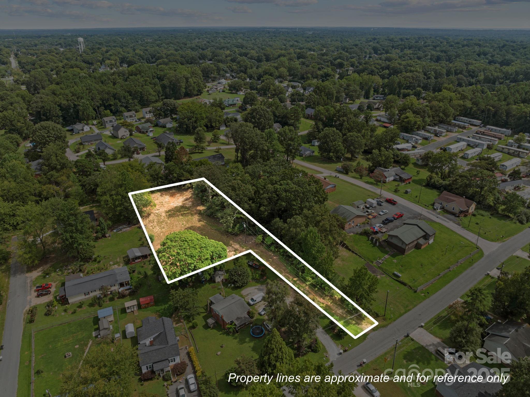 Buildable lot near downtown Kannapolis with city-confirmed approval for a single-family residence. Enjoy the privacy of this "flag" lot allowing you to build a home off the road. City water and sewer available. Conveniently located close to shopping, dining, the Cannon Ballers Stadium, Gem Theatre, and plenty of entertainment. Easy access to I-85 makes this a prime spot to build your new home or investment property. Whether you're a builder, investor, or future homeowner, this lot offers incredible potential in a desirable and rapidly growing area. Come be part of the exciting Kannapolis revitalization!