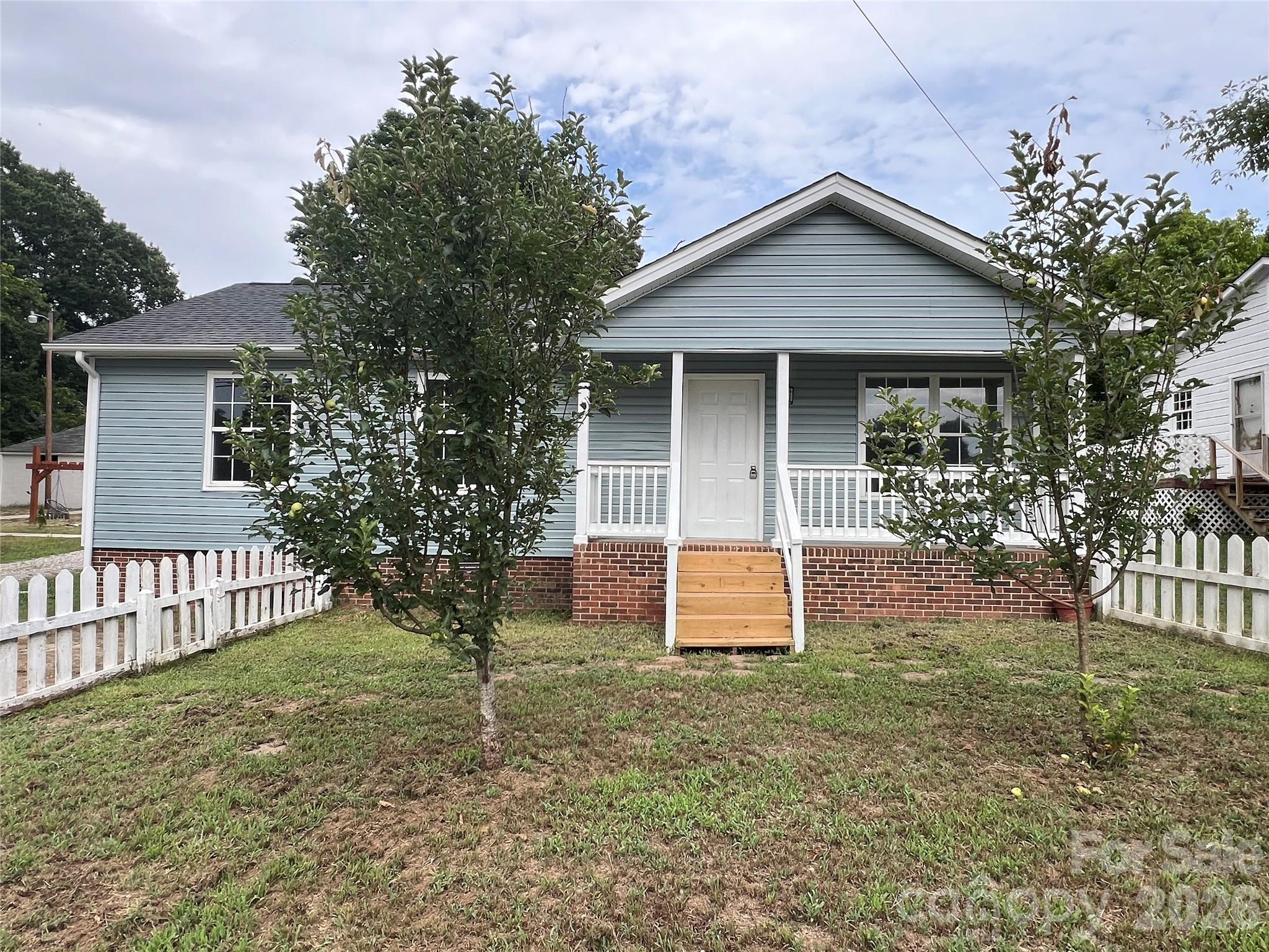 Charming one-story home featuring 3 bedrooms and 1 full bath, built in 1990 and situated on a large, level lot in a quiet neighborhood in booming Kannapolis—with no HOA! 
The functional single-level floor plan includes a spacious great room, kitchen with dining area, a generous primary bedroom with walk-in closet, well-sized second bedroom with double closets, smaller third bedroom ideal for use as a nursery, home office, or guest room, a full bath, and a laundry room.
Recent updates include new luxury vinyl plank flooring, fresh interior and exterior paint, beautiful marble-look quartz countertops in the kitchen, and a brand-new microwave. The water heater was replaced in 2023. Washer and dryer convey with the home, making this move-in-ready property an excellent opportunity for homeowners and investors alike.
Both back and front yards are fenced with fruit trees. Enjoy added privacy in the spacious backyard, which backs to peaceful woods. Conveniently located just minutes from the NC Research Campus, downtown Kannapolis, a modern Ballpark, public library, YMCA, parks, shopping, dining, and entertainment, this hidden gem offers exceptional value at an affordable price.
To provide additional flexibility, seller is offering a $5,000 credit toward the buyer's closing costs in lieu of the aging but still functional HVAC system and minor repairs.