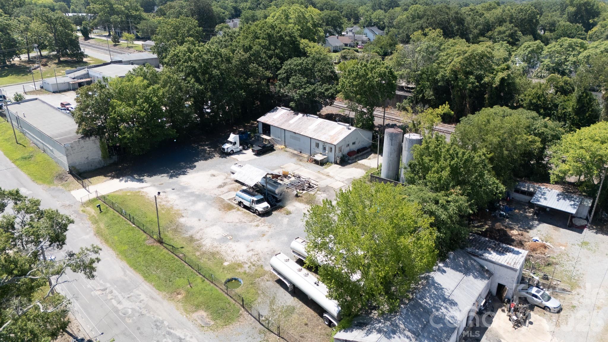Excellent industrial opportunity within the Rock Hill city limits. Located at 534 Pendleton St, this specialized turnkey fuel and oil facility is optimized for high-intensity use and immediate operational continuity. The property features an Industrial General (IG) zoning designation, allowing for a wide range of compliant industrial applications. Fully fenced for security, the site includes 45,000 gallons of integrated fuel storage tank capacity and two tanker trucks included in the sale, providing immediate distribution capabilities from day one. The infrastructure consists of 1,891 square feet of heated and cooled office space, configured with a reception area, seven private offices, two closets, and two half bathrooms. Additionally, the property offers 1,345 square feet of unheated warehouse space equipped with a bay door and loading dock for seamless loading and logistics. Situated with excellent proximity to major transit corridors, this specialized asset is highly suited for an owner-operator looking to expand their footprint or an investor seeking a strategic position within the high-growth Charlotte metro periphery.