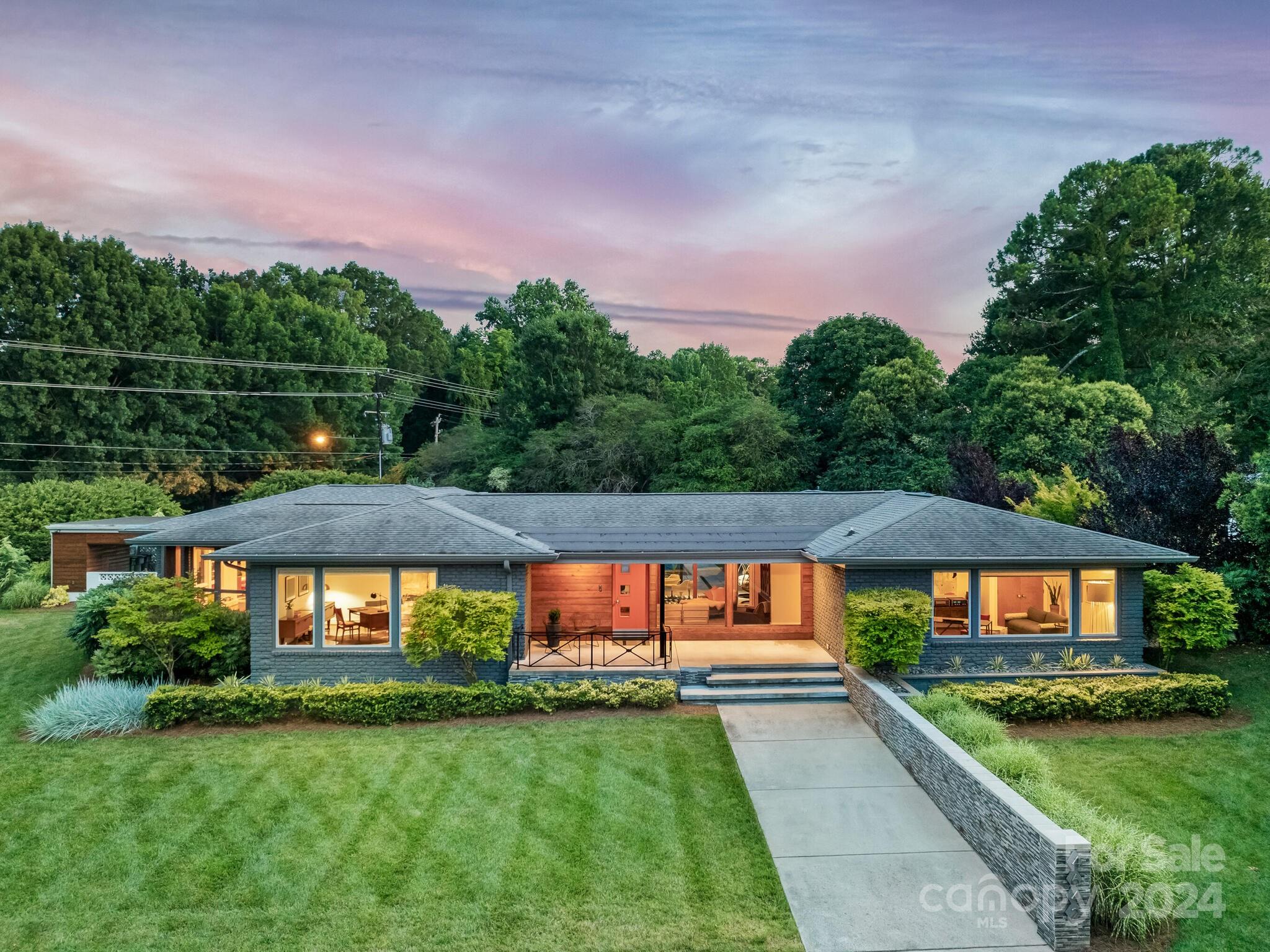 Nostalgia in Nature on 1.2 acres of prime real estate. Live your best life amongst year-round evergreen, refreshing water, & soothing ribbon flames. Work, play, swim, & dine to your heart’s delight where windows are walls & indoors harmonizes w/peak outdoor living. Allow the foyer & den to welcome you to the covered porch overlooking an outdoor oasis. Wind your way into the kitchen where 2 islands hub the beautiful dining & entertainment setting flanked by a continuous view of plush green nature. Command the business world with your home office adorned in natural light from near floor-to-ceiling windows. Slide into the EuroCave’s hallway for a drink or buffet before you step outside to the private pool setting. The adjacent wing boasts all bedrooms ensuite plus an incredible primary WIC & bath bookending a bedroom setting nestled btwn a Zen-like garden & personal pool entrance. Multiple tech features fully integrated to your phone via the Control 4 app. Welcome to your favorite home!