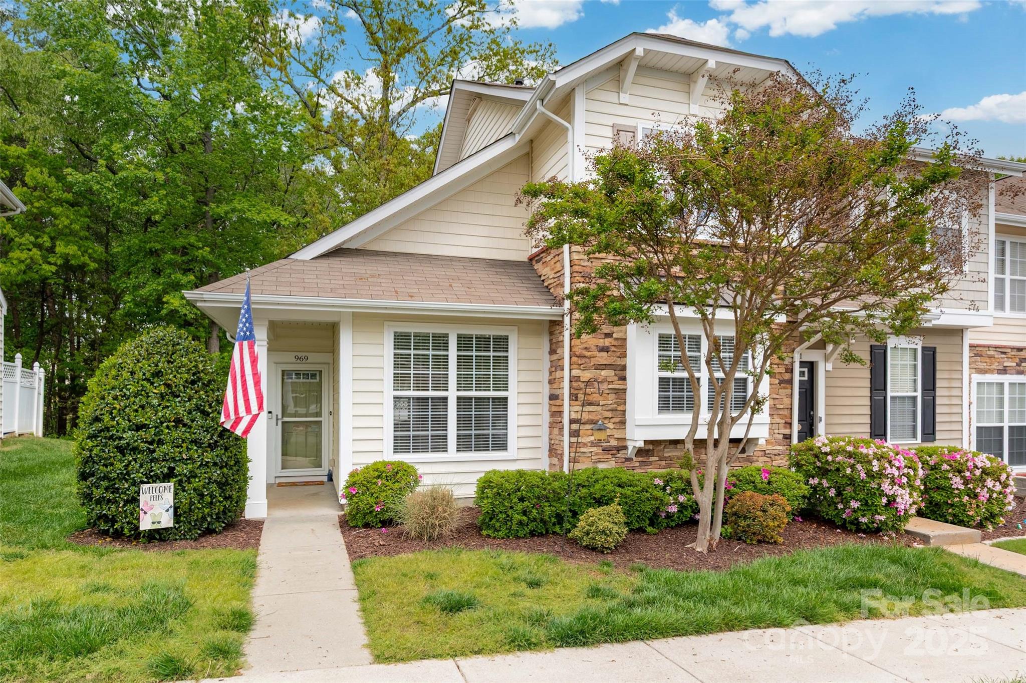 Beautifully updated END UNIT, w/ Primary and laundry on main with private treed backyard. Tucked in the quiet, tree-lined portion of the popular Fieldstone Community. Soaring ceilings, many windows invite tons of natural light.  Open concept floorplan, dining area w/built-in, renovated kitchen; All NEW: painted cabinets, farmhouse sink, backsplash and quartz counters. Powder rm w/new sink and vanity. Large family room w/french doors leading to a fully fenced, private courtyard. Generous owner's suite, gorgeous primary bath features a soaking tub with tiled surround, waterfall faucet & rainfall shower, walk-in closet. Spacious secondary brms and hall ba with new shower unit. Neighborhood clubhouse, pool and pond. Enjoy maintenance-free living w/privacy. Fort Mill Schools and Low SC taxes & low HOA. Nearby shopping, dining, only 3mi from I-77. More recent updates: New gas furnace (a/c 2017), carpet and ceiling fans in LR and Primary.  See agent comments for full list.