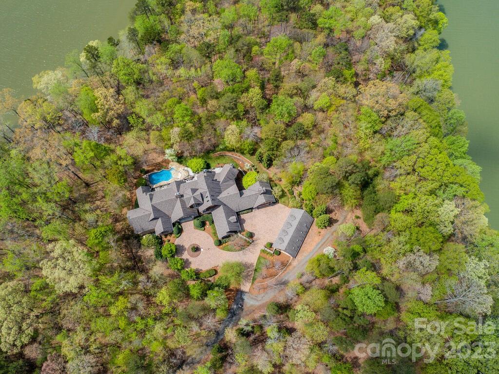 * Over 17,000 total heated square feet
* Guest house
* 11-Acres
*Waterfront
*This gated waterfront estate offers incredible privacy and is only 30-minutes from Uptown Charlotte.  You truly must see this spectacular home built by Arcadia to appreciate.