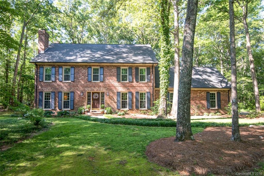 Weddington living at its best! Full Brick home on over 2 acres. Kitchen features updated cabinets & granite counters. Hardwoods through-out! So many features- built-ins, 2 fireplaces, pocket doors, enclosed bar, exposed beams, recessed lighting, painted garage floor, moldings & more! Bathrooms remodeled w/ quartz counters & frameless oversized shower in master. Relax in sunroom, bonus room or enjoy 1 of 3 decks!  New windows in 2015. Beautiful neighborhood mins from Matthews, Ballantyne & 485.