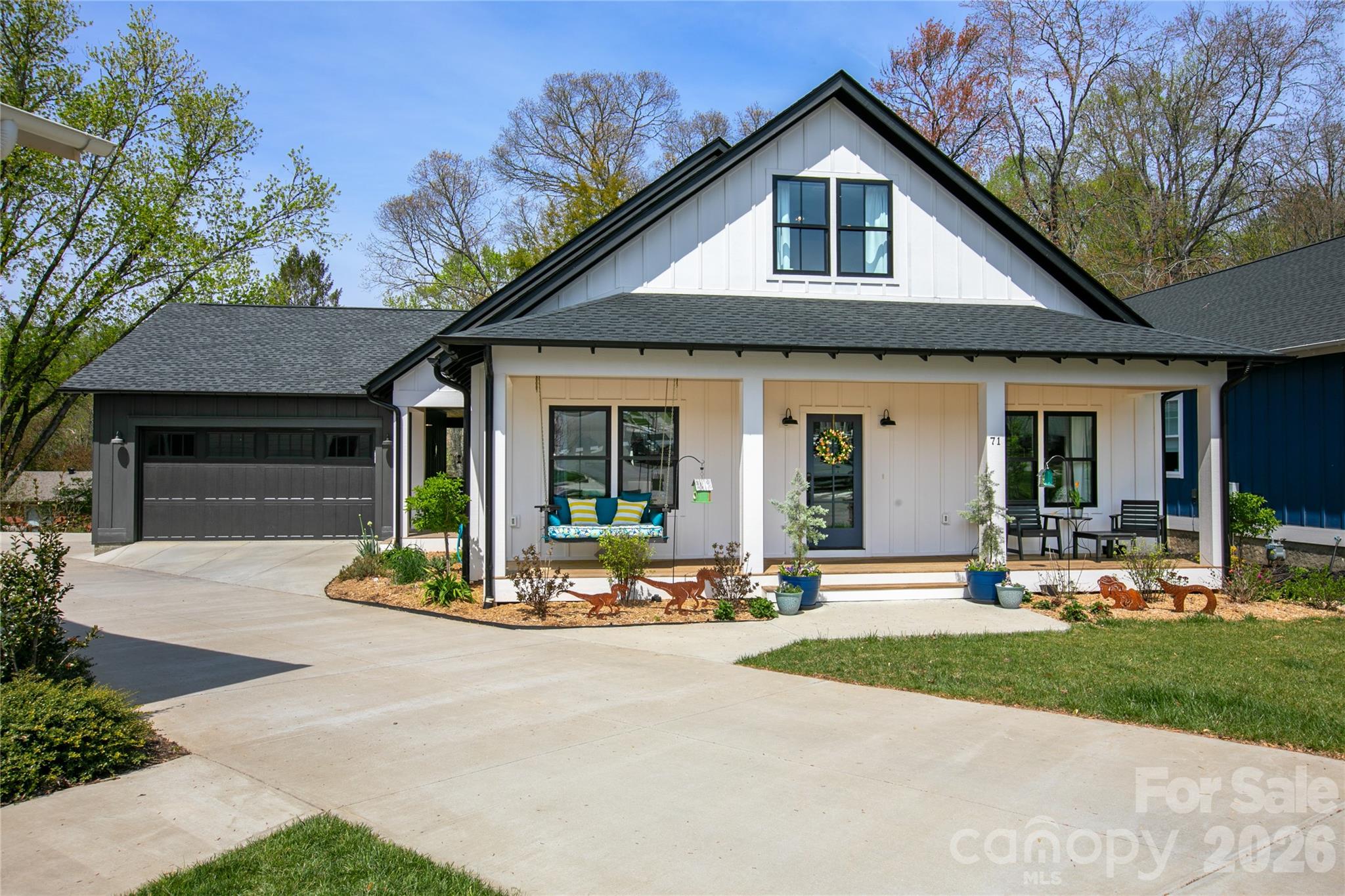 Welcome to 71 Hidden Pond Lane, where modern farmhouse style meets easy, everyday living with just the right amount of personality. Originally designed as a five-bedroom home, the sellers are currently using two of the bedrooms as an office and a bonus room, creating ideal spaces for remote work, hobbies, movie nights, or simply keeping life organized. Need all five bedrooms again? No problem, they can easily be converted back.

Built in 2023, this home brings that fresh, clean feel with thoughtful upgrades already in place. From the moment you arrive, the inviting front porch, custom landscaping, and extra two-car parking pad make hosting friends and family feel effortless and fun.

Inside, the bright and open layout is made for real life. Whether you are entertaining a crowd or enjoying a quiet night in, the space feels warm, connected, and comfortable. Hickory hardwood floors, custom lighting, and stylish tile add character, while large windows keep everything light and airy. The upstairs has been expanded for even more living space, and one of the bedrooms even features a hidden, lockable storage compartment because who doesn’t love a great secret feature?

Downstairs, the walk-out basement is unfinished and ready for your vision. Create additional living space, a workshop, fitness area, or the ultimate hangout spot. It is a blank canvas with tons of potential.

Step outside and you will quickly see why this home stands out. The extended porch is ready for your natural gas grill and features a cozy fireplace that makes it just as inviting on cool evenings as it is on sunny afternoons. This is the kind of space where weekends tend to disappear in the best way.

The landscaping has been thoughtfully designed to be both beautiful and low-maintenance. The front yard features a wildflower pollinator garden that creates a welcoming and ever-changing display. Throughout the property, native trees, shrubs, and plants have been carefully selected to thrive and are meant to be largely left alone. Ground plantings are all perennials that self-propagate and are specifically suited to the backyard's unique sun and moisture conditions. Raised terraced garden beds, organic mulch, and established blueberries, raspberries, strawberries, and herbs make it easy to enjoy your own backyard garden from day one.

This home has also been meticulously maintained for peace of mind, with a whole-home water filtration system, a tankless water heater, a sealed crawl space with a sump pump, ongoing Terminix coverage, and a recent HVAC check in October 2024. It is even on the hospital electrical grid, which meant the lights stayed on during Hurricane Helene. The home is currently using Starlink, with Comporium still available, and is wired for a home phone if you ever feel like going a little retro.

Located in Brevard Ridge, a friendly and close-knit community known for neighborhood gatherings, this is the kind of place where neighbors wave, kids ride bikes, and people truly get to know each other.

When you are ready to explore, you are just minutes from downtown Brevard, Pisgah Forest, and the Davidson River. Spend your days hiking, biking, or fishing, then head into town to enjoy Brevard’s vibrant mix of art galleries, local shops, and great restaurants. It is the perfect balance of outdoor adventure and small town charm.

If you have been looking for a home that feels as good as it looks, this one is ready to welcome you in and make you right at home. Professional Floor plan now available