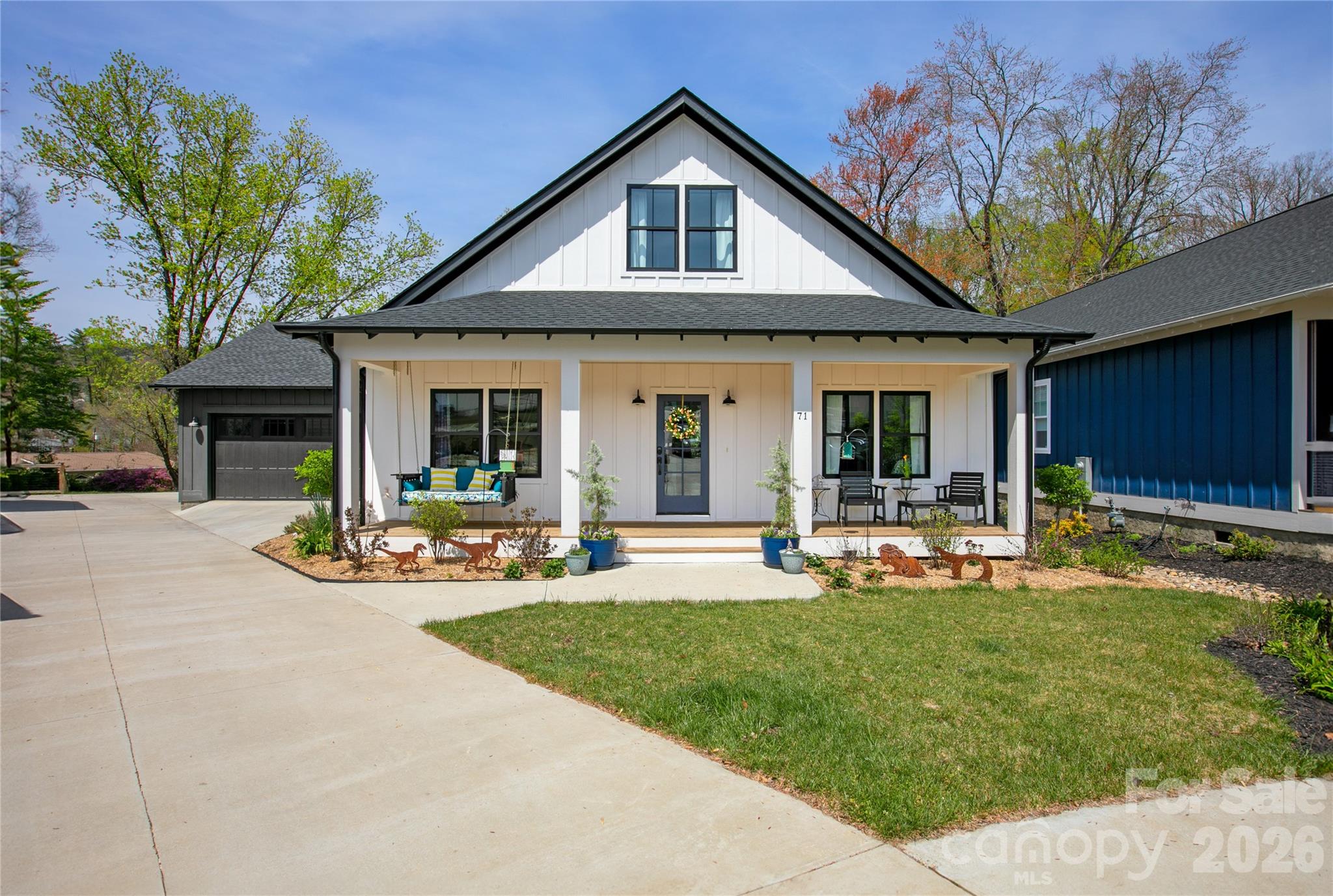 Welcome to 71 Hidden Pond Lane, where modern farmhouse style meets easy, everyday living with just the right amount of personality. Originally designed as a five-bedroom home, the sellers are currently using two of the bedrooms as an office and a bonus room, creating ideal spaces for remote work, hobbies, movie nights, or simply keeping life organized. Need all five bedrooms again? No problem, they can easily be converted back.

Built in 2023, this home brings that fresh, clean feel with thoughtful upgrades already in place. From the moment you arrive, the inviting front porch, custom landscaping, and extra two-car parking pad make hosting friends and family feel effortless and fun.

Inside, the bright and open layout is made for real life. Whether you are entertaining a crowd or enjoying a quiet night in, the space feels warm, connected, and comfortable. Hickory hardwood floors, custom lighting, and stylish tile add character, while large windows keep everything light and airy. The upstairs has been expanded for even more living space, and one of the bedrooms even features a hidden, lockable storage compartment because who doesn’t love a great secret feature?

Downstairs, the walk-out basement is unfinished and ready for your vision. Create additional living space, a workshop, fitness area, or the ultimate hangout spot. It is a blank canvas with tons of potential.

Step outside and you will quickly see why this home stands out. The extended porch is ready for your natural gas grill and features a cozy fireplace that makes it just as inviting on cool evenings as it is on sunny afternoons. This is the kind of space where weekends tend to disappear in the best way.

The landscaping has been thoughtfully designed to be both beautiful and low-maintenance. The front yard features a wildflower pollinator garden that creates a welcoming and ever-changing display. Throughout the property, native trees, shrubs, and plants have been carefully selected to thrive and are meant to be largely left alone. Ground plantings are all perennials that self-propagate and are specifically suited to the backyard's unique sun and moisture conditions. Raised terraced garden beds, organic mulch, and established blueberries, raspberries, strawberries, and herbs make it easy to enjoy your own backyard garden from day one.

This home has also been meticulously maintained for peace of mind, with a whole-home water filtration system, a tankless water heater, a sealed crawl space with a sump pump, ongoing Terminix coverage, and a recent HVAC check in October 2024. It is even on the hospital electrical grid, which meant the lights stayed on during Hurricane Helene. The home is currently using Starlink, with Comporium still available, and is wired for a home phone if you ever feel like going a little retro.

Located in Brevard Ridge, a friendly and close-knit community known for neighborhood gatherings, this is the kind of place where neighbors wave, kids ride bikes, and people truly get to know each other.

When you are ready to explore, you are just minutes from downtown Brevard, Pisgah Forest, and the Davidson River. Spend your days hiking, biking, or fishing, then head into town to enjoy Brevard’s vibrant mix of art galleries, local shops, and great restaurants. It is the perfect balance of outdoor adventure and small town charm.

If you have been looking for a home that feels as good as it looks, this one is ready to welcome you in and make you right at home. Professional Floor plan now available