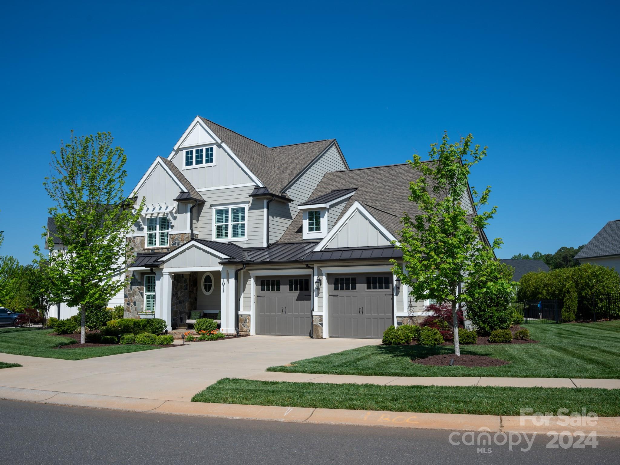 Welcome home to the highly sought after Arden Mill community in Fort Mill, SC. Where life meets luxury custom homes bordered by lifestyle amenities w/in walking distance (restaurants;exercise facilities; nail salon;Doctor offices and more to come).This particular home has all the desired upgraded selections and is very well maintained. It also is on one of the largest lots available in the community.Primary bedroom on Main level as well as a Guest Suite w/full bathroom;Cascading Sliding Doors in the vaulted ceiling great room overlooking the backyard and inground pool. Upgraded features throughout:Ceilings and walls w/accented trim work;oversized island,stacked cabinetry to the ceiling as well as the added bar cabinetry and beverage area;built in commercial grade fridge; upgraded appliances; elevated flooring and tile selections;custom lighting throughout; covered porch; and in-ground pool. Also features a Tankless water heater&2 car EXTENDED garage. Don't wait to build move right in.