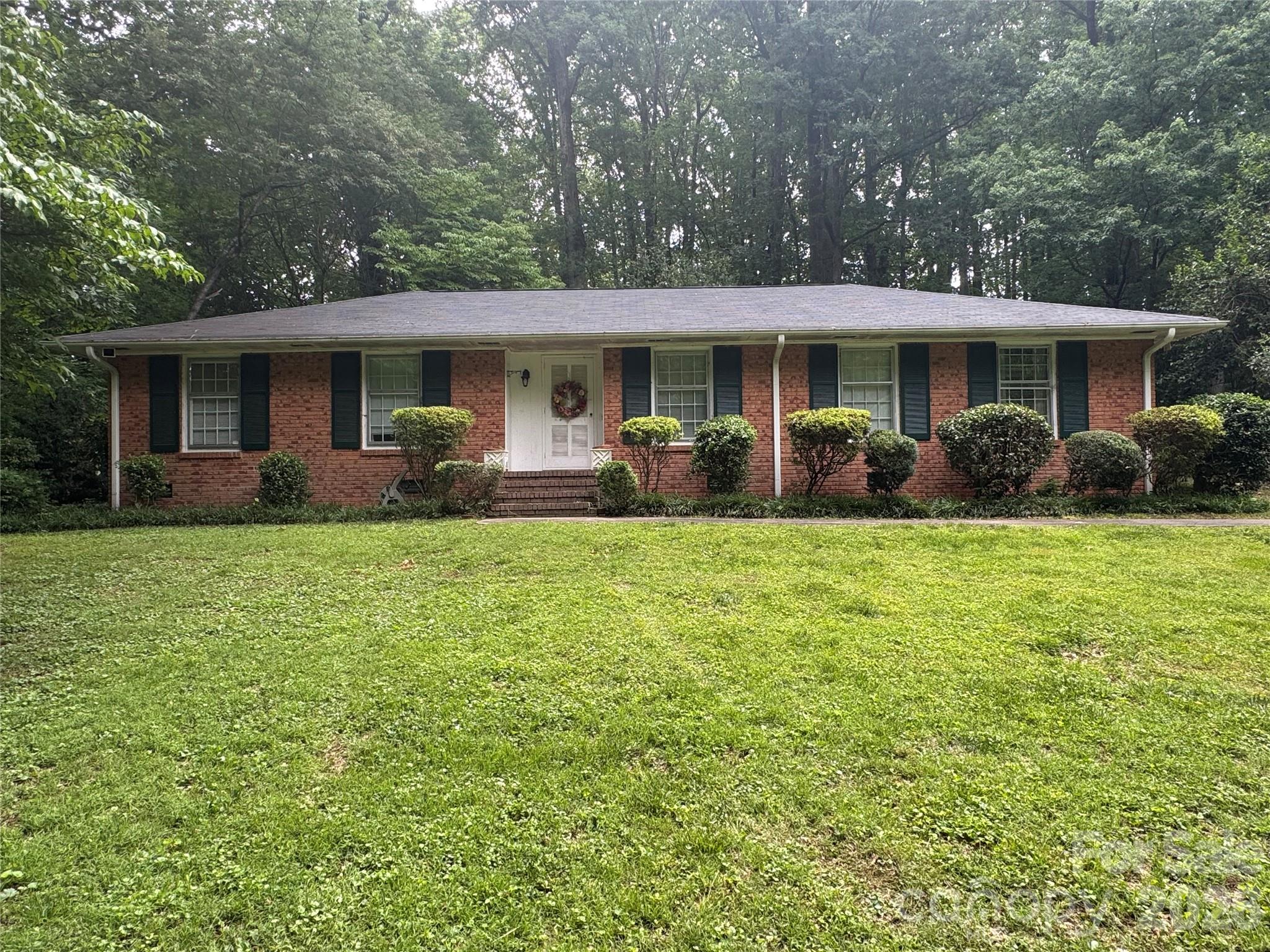 Built to last in 1959! This 1 story full brick ranch sits estately on a deep wooded lot in the beautiful Hickory Grove neighborhood. A little tlc is needed to bring this back to its original beauty.  Home being sold as is and has not been cleaned out fully.